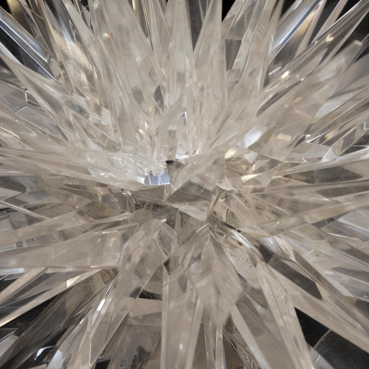 This gorgeous hand-carved and polished crystal star was created by the American artist Mark Yurkiw for brochure photography. Today, it would lend itself well as a centerpiece on a dining table or a console table. The design is reminiscent of the
