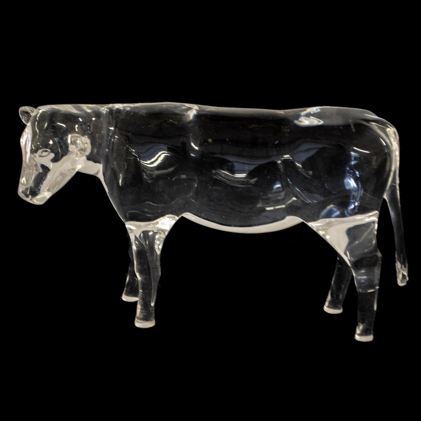 This set of hand-carved and polished acrylic cows was created by artist Mark Yurkiw for brochure photography. As such, they are only 75% three-dimensional, with a flat rear surface. Today, these decorative figurines would add a sense of charm
