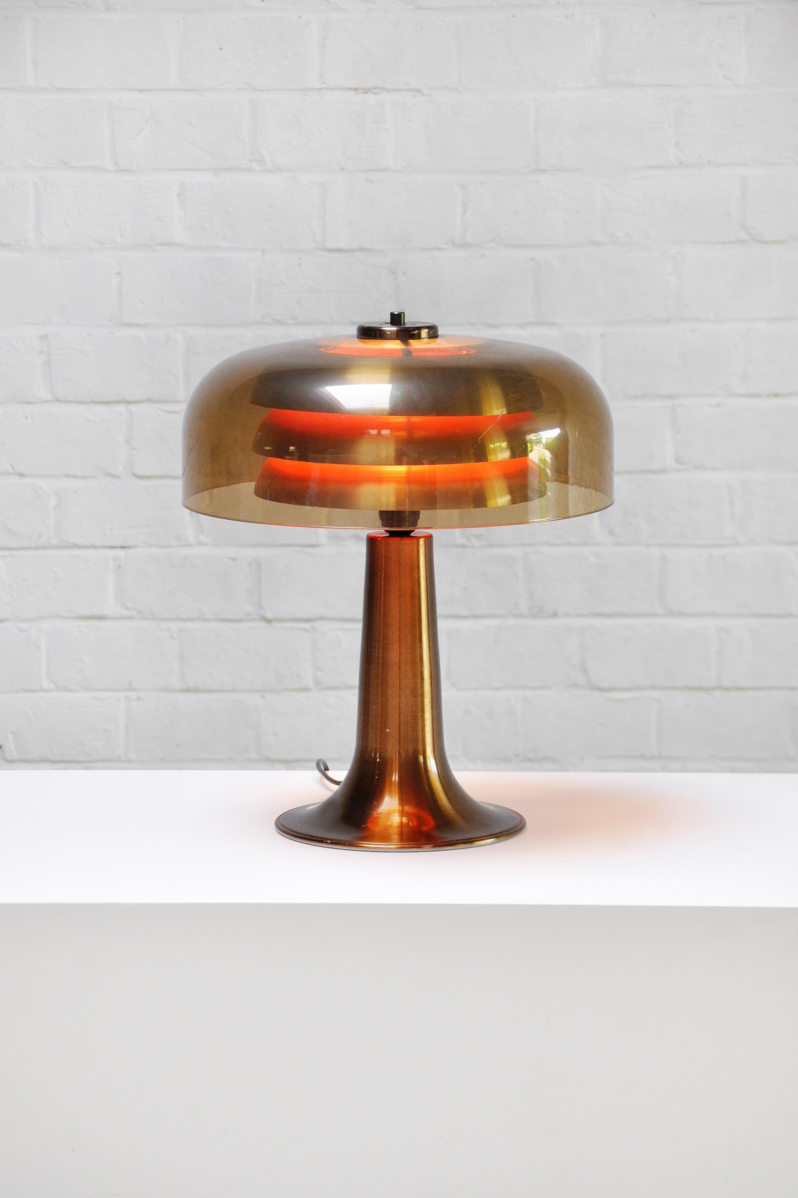 A beautiful and very decorative table lamp made of bronzed aluminium with an acrylic shade. This lamp is unsigned but due to the similarity to BN25 model lamps, this model is attributable to Swedish designer Hans-Agne Jakobsson. Unique to this