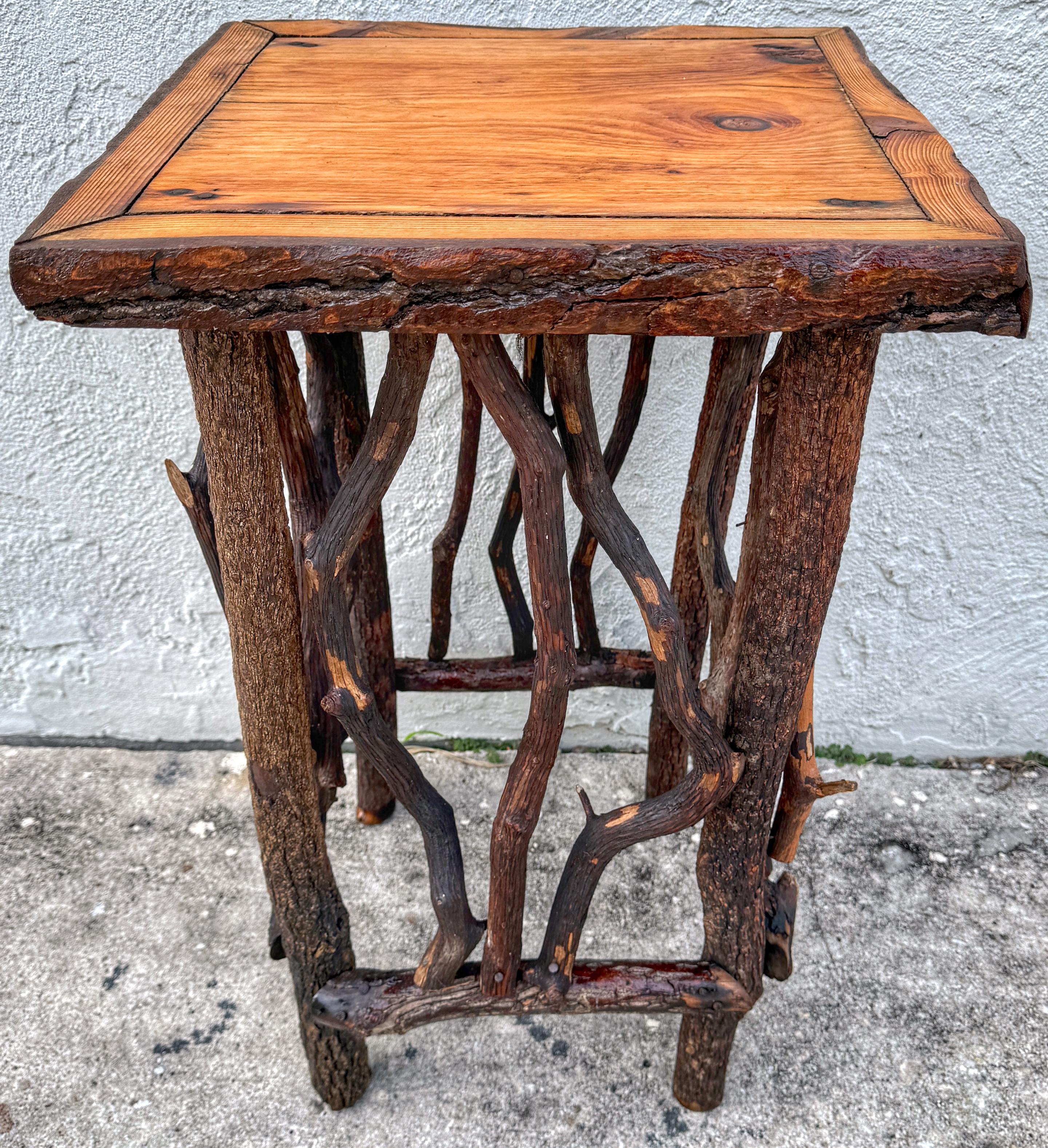 Vintage Adirondack Log and Twig Table/Pedestal with Pine Top
USA, 20th century 

Vintage Adirondack Log & Twig Table/Pedestal, originating from the USA in the 20th century Representing quintessential American Adirondack furniture, this piece stands