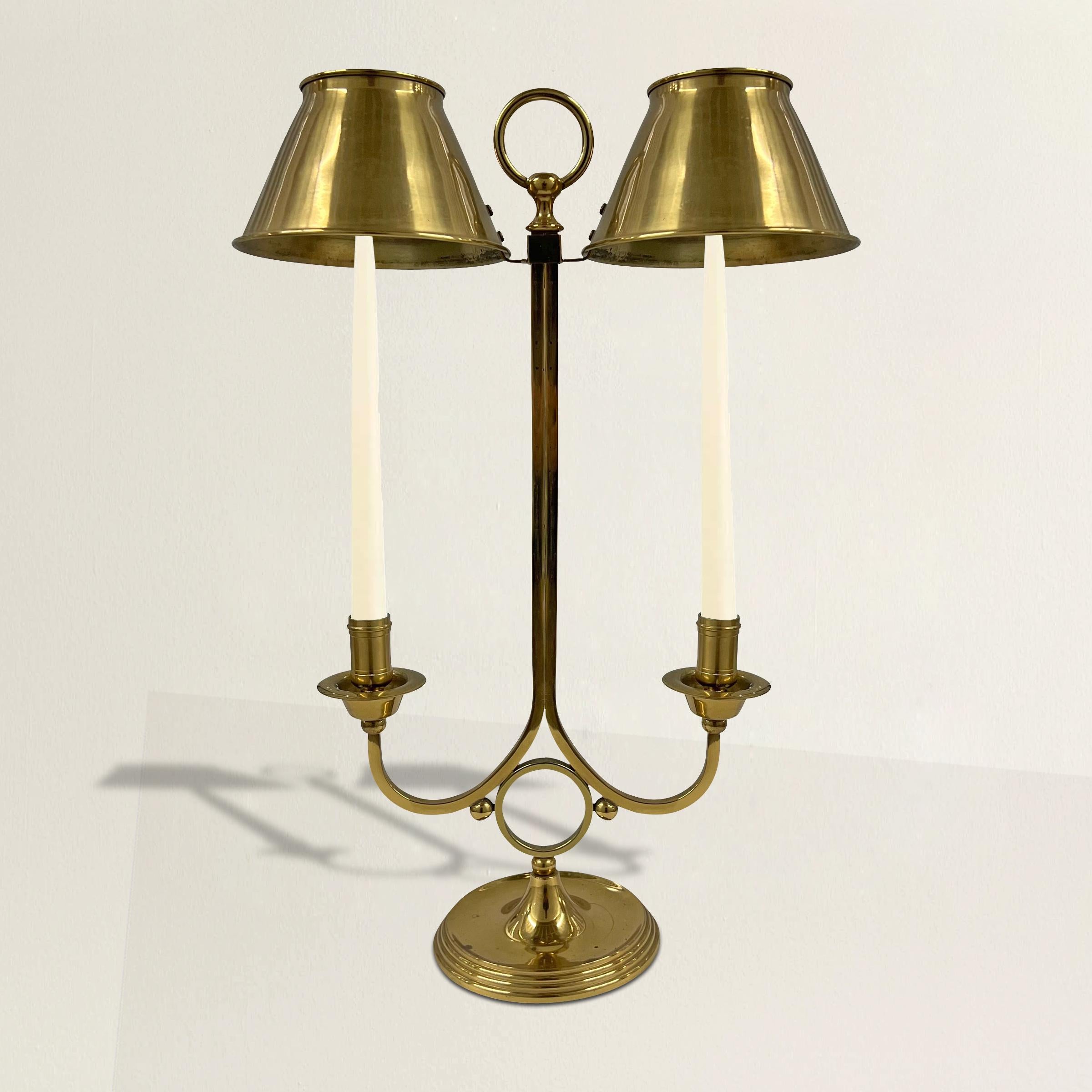 A chic vintage American brass two-arm candle lamp with shades that can be adjusted as the candles burn.  Perfect for your dining table or console table at your next dinner party!