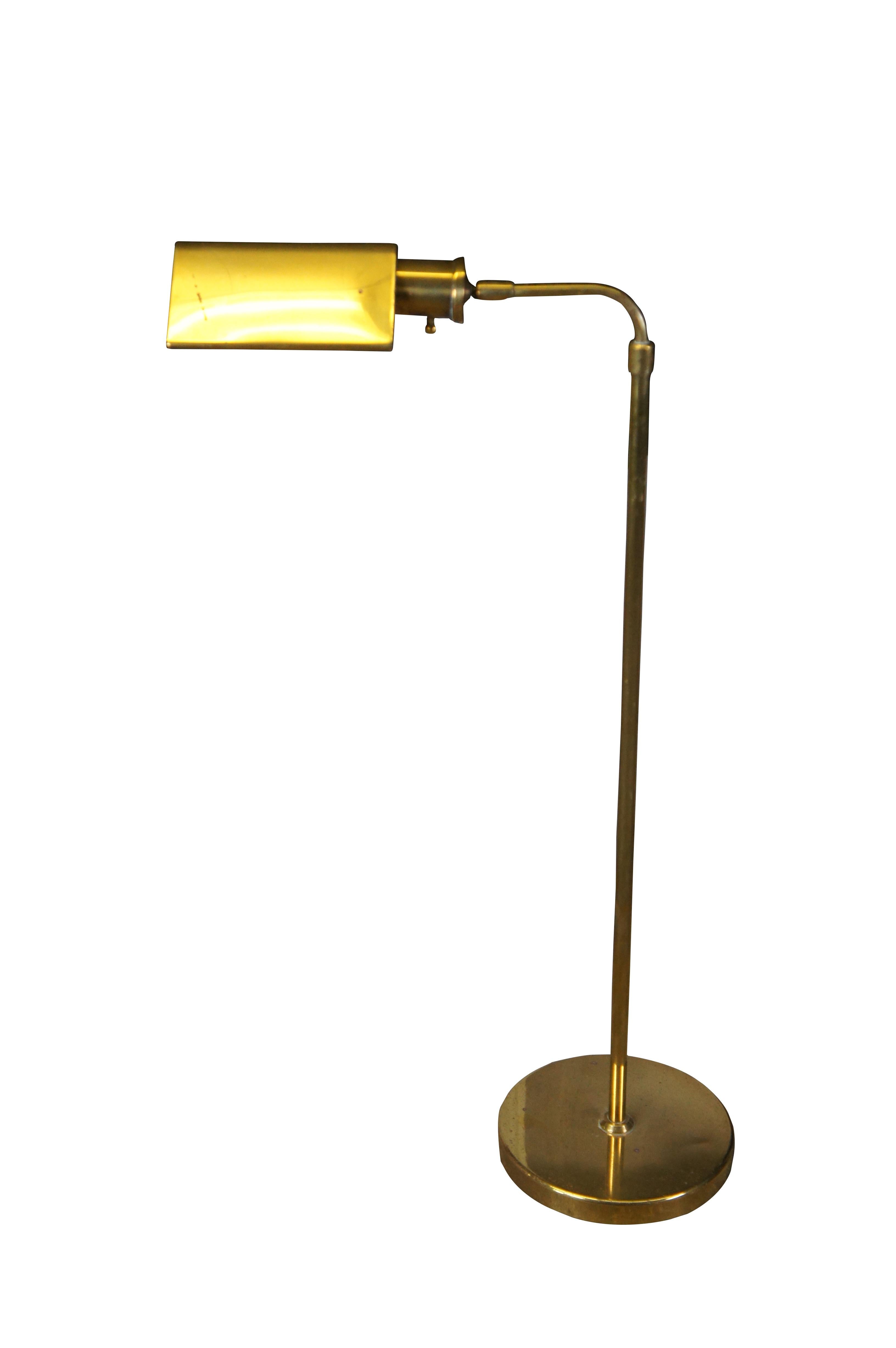Vintage / mid century brass pharmacy / apothecary / library reading light / floor lamp featuring an adjustable and articulating shade and body with dimmable light.  Marked Heyco on base.

Dimensions:
23