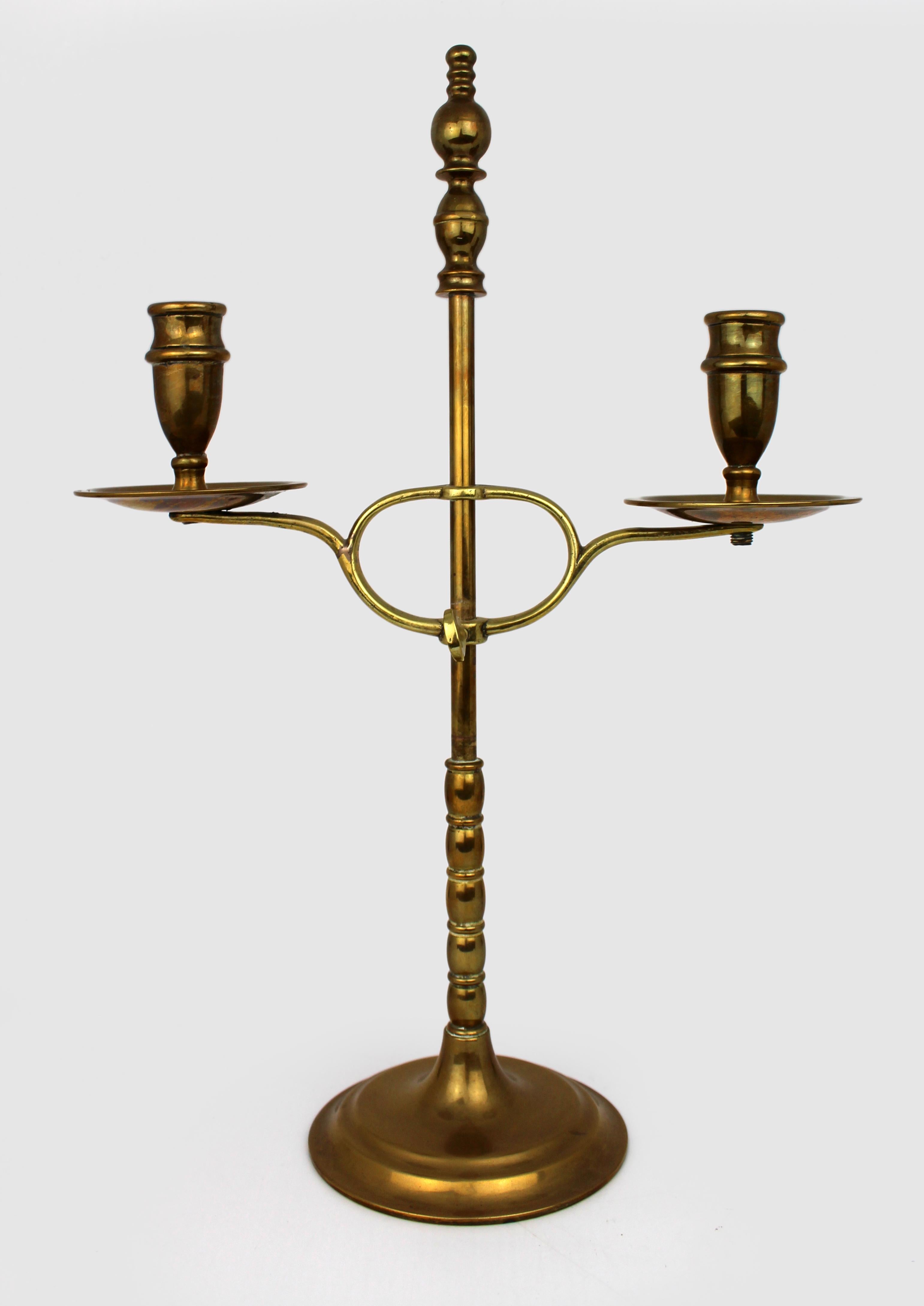 
Vintage Adjustable Brass Twin-Arm Candelabra, Mid-20th Century
A handsome and well-proportioned brass candelabra featuring twin candle arms and an adjustable-height mechanism. Likely dating to the mid-20th century, this piece is finely cast with a
