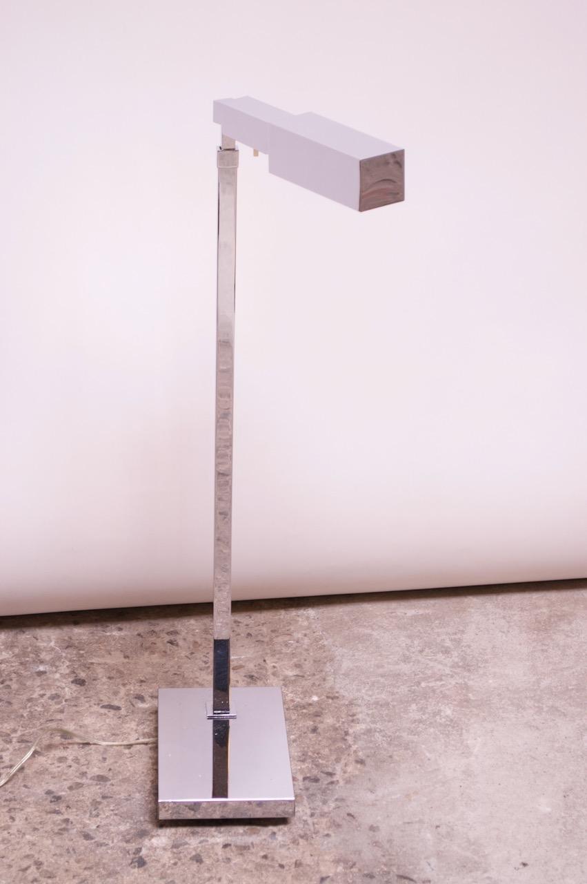 1970s chromed-steel floor lamp with rectilinear design by Casella Lighting of San Francisco, CA. Composed of an adjustable, cantilevered shade with height and 360 degree swivel adjustability. Original on / off switch present; wiring is new. 
Chrome