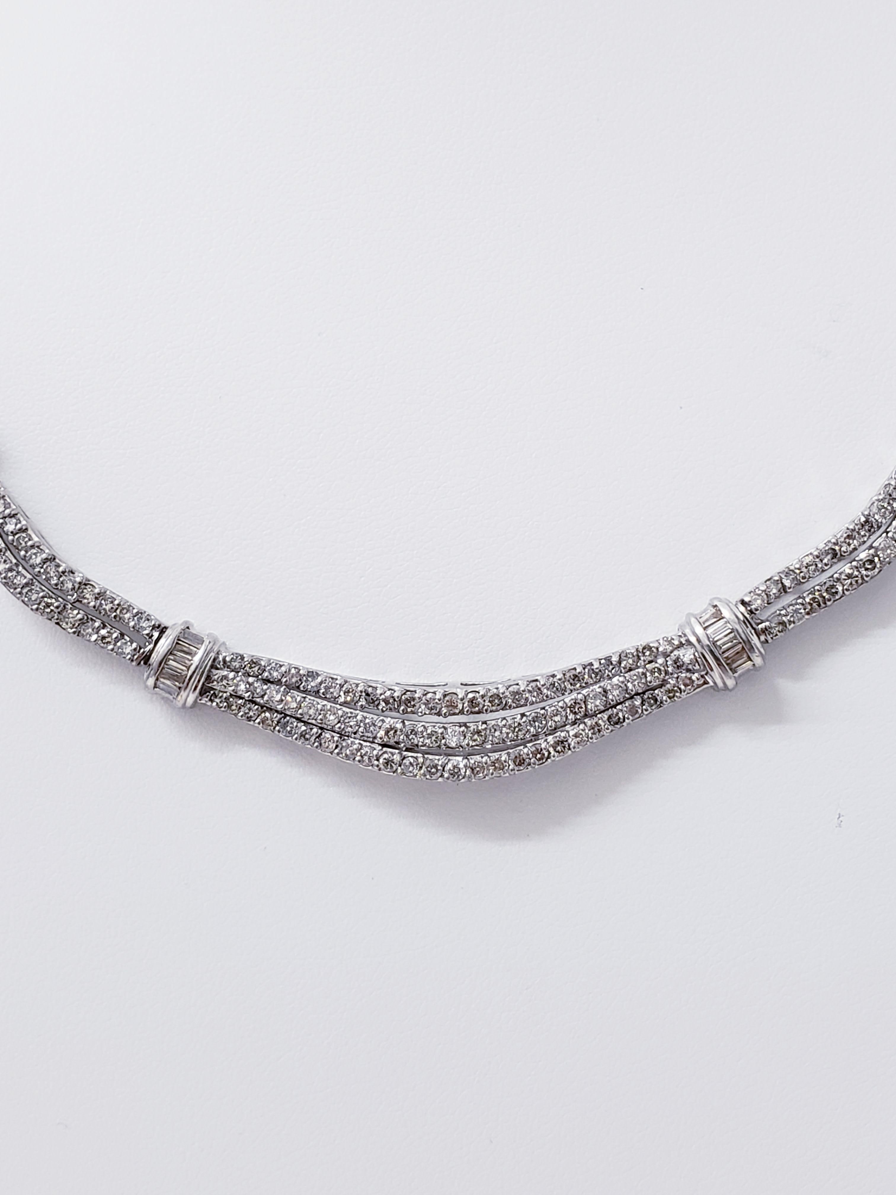 Vintage 12 Total Carats Full Diamonds Necklace Signed ADL in 14k solid white gold. The diamonds feature baguette and round diamonds approx 12 carats total weight. The length of the necklace is 18 inches long and weights 26.3 grams 14k solid gold.