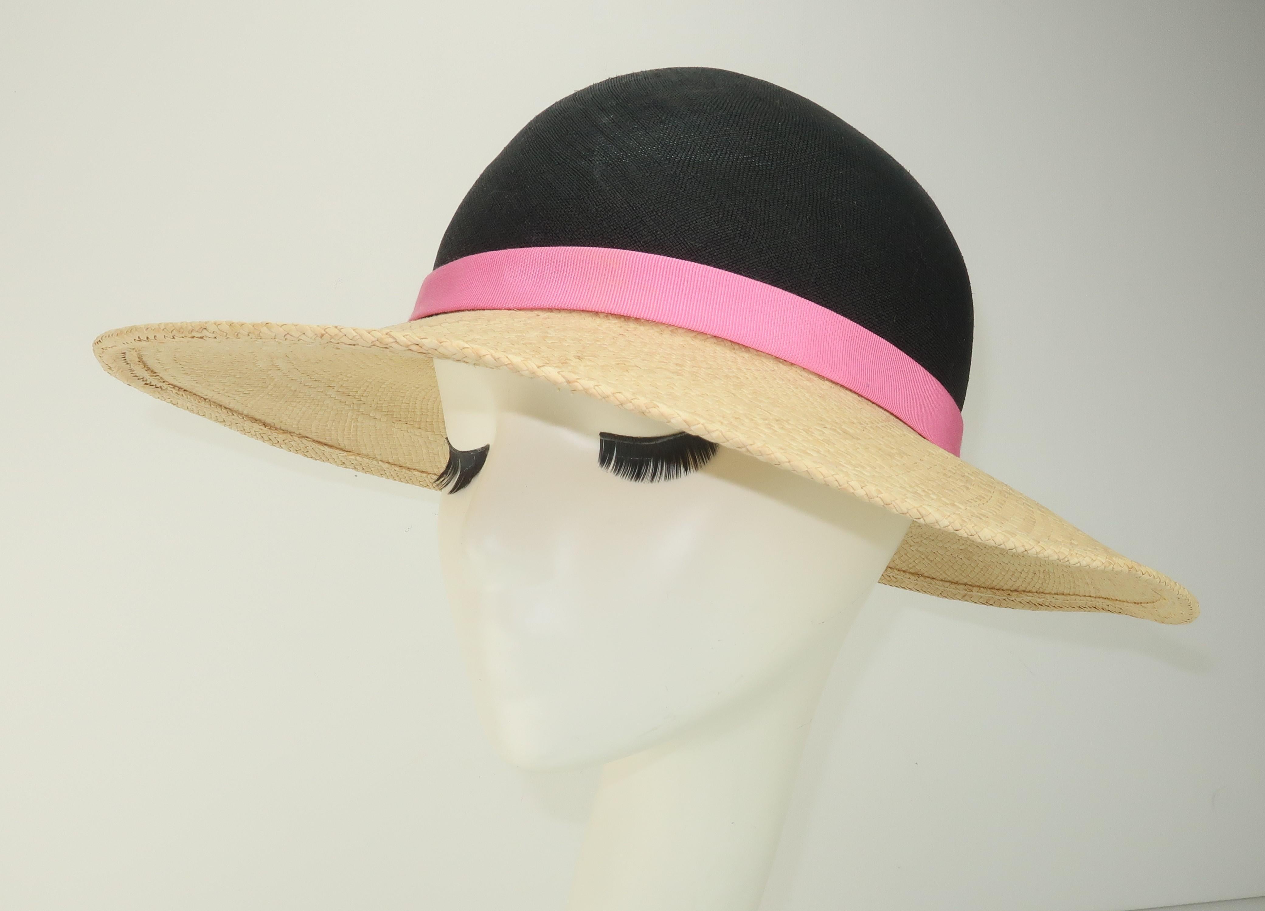 Simple and stylish!  An Adolfo II straw hat with natural brim, midnight blue (almost black) crown and a hot pink band for a little color splash.  Originally retailed at Saks Fifth Avenue ... previously owned though never worn with tag still