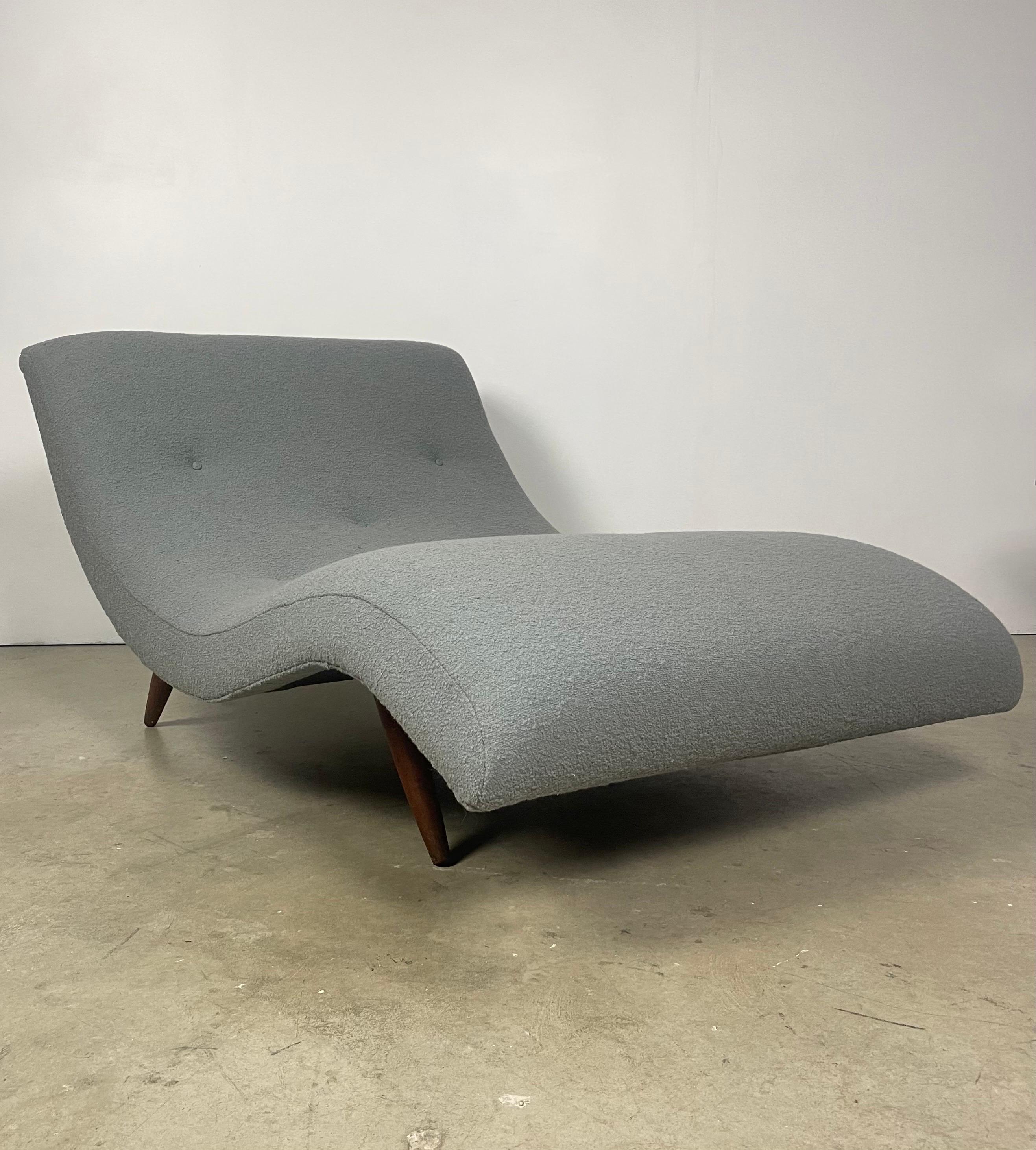 
This vintage Adrian Pearsall chaise lounge has been expertly restored and reupholstered in Knoll Boucle, a luxurious and durable fabric. The curved design of the chaise offers ultimate comfort and relaxation, while the sturdy wooden frame provides