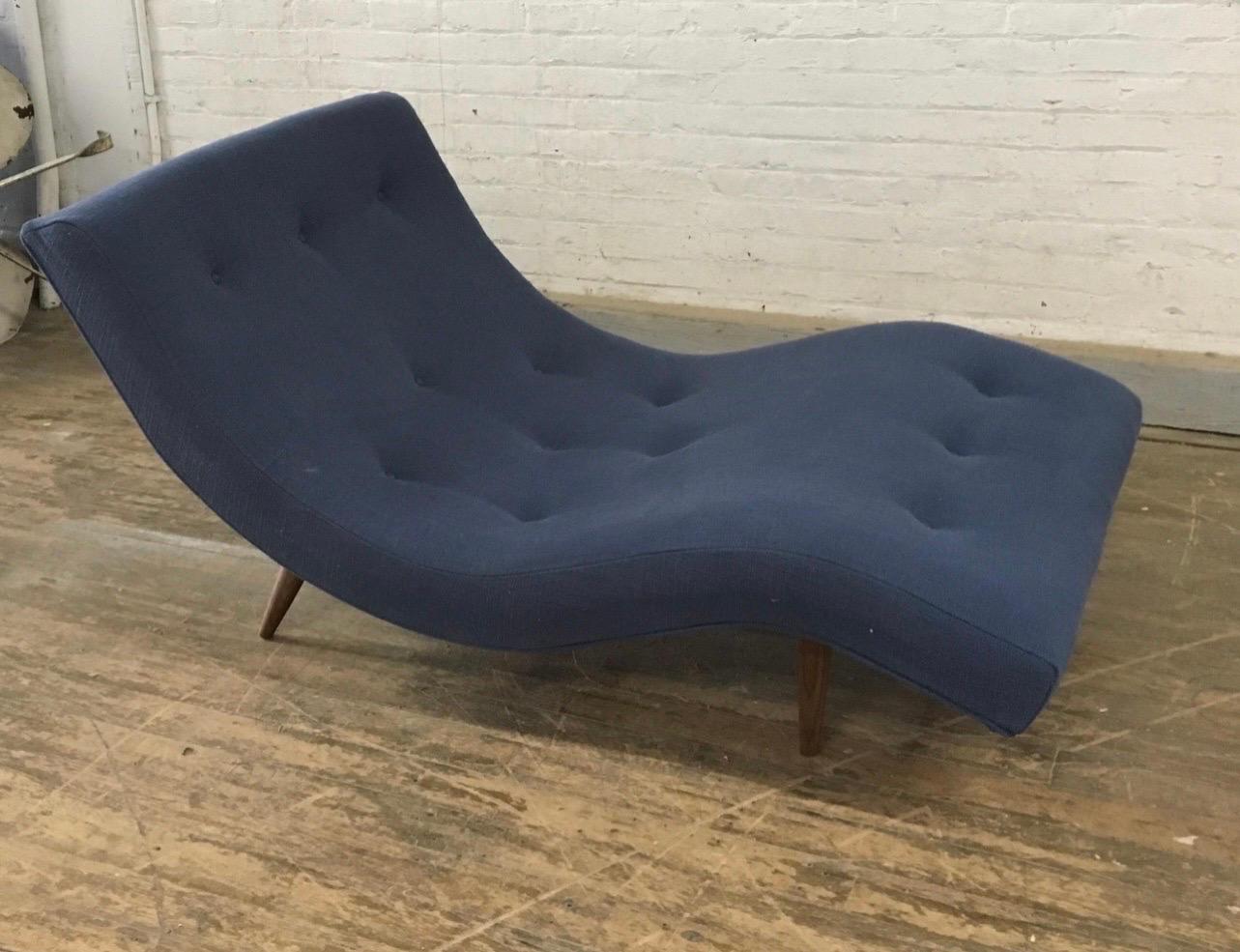 This vintage Adrian Pearsall chaise lounge has been expertly restored and reupholstered. The curved design of the chaise offers ultimate comfort and relaxation, while the sturdy wooden frame provides stability and support. This piece is a true