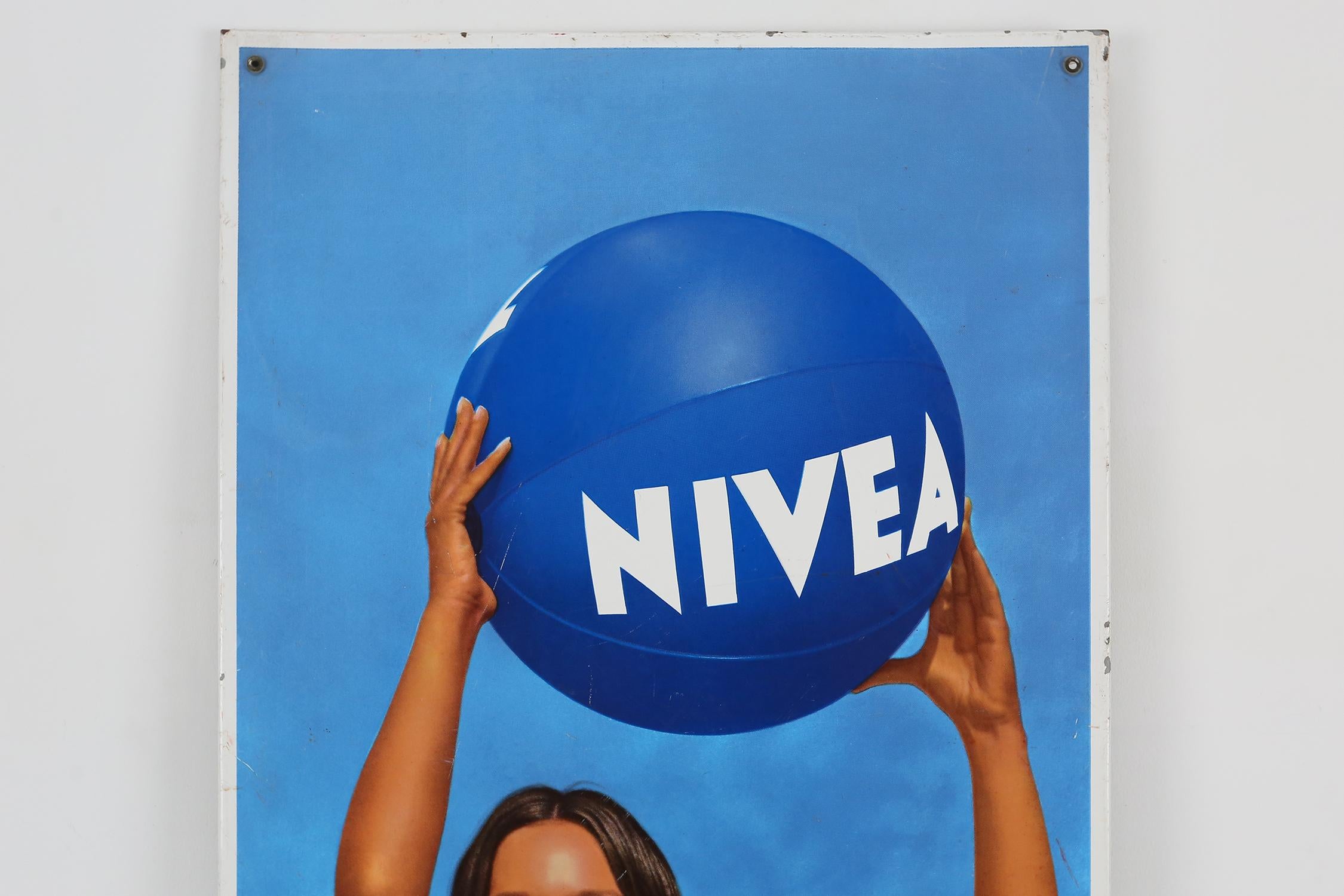 Vintage sign in metal, advertising 'Nivea', a great item for on the pool or in the pool house.