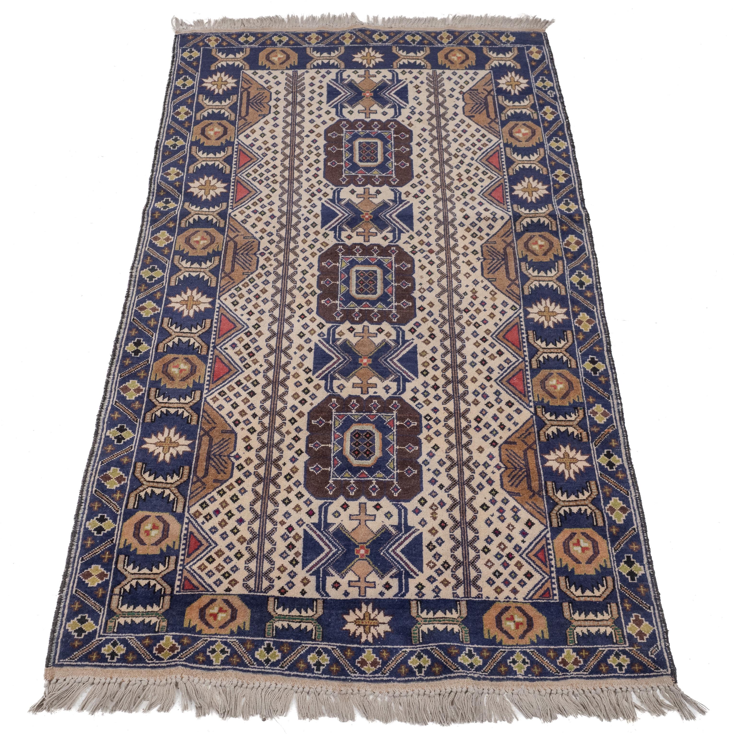 A vintage Afghan Baluch rug, approximately 7' x 3'10
