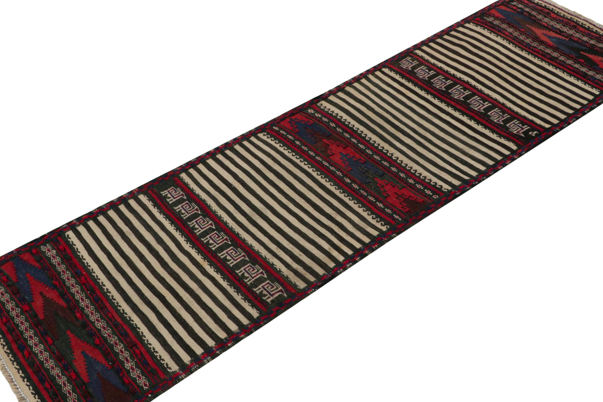 Handwoven in wool, this 2x7 vintage Afghan Baluch tribal kilim runner rug, circa 1950-1960, is an exquisite tribal piece that was often used as table covers in nomadic daily life, much similar to Persian Sofreh Kilims. 

On the Design: 

Tribal