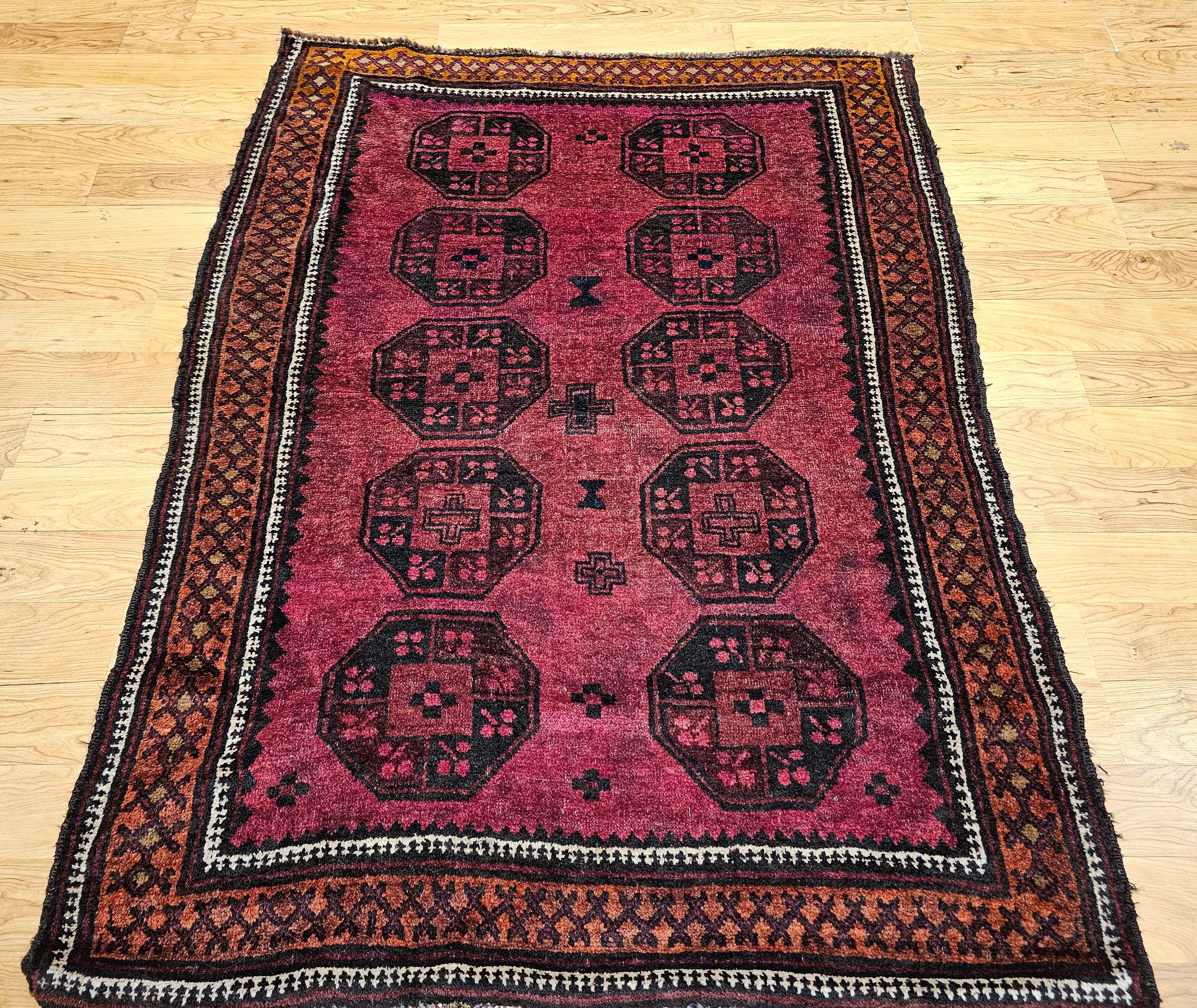 Vintage Hand-Knotted Afghan Bokhara Area Rug, hand knotted in the mid-1900s. Bokhara rugs are celebrated for their distinctive geometric patterns and the unique luster of their wool, and this piece is a magnificent embodiment of that cherished