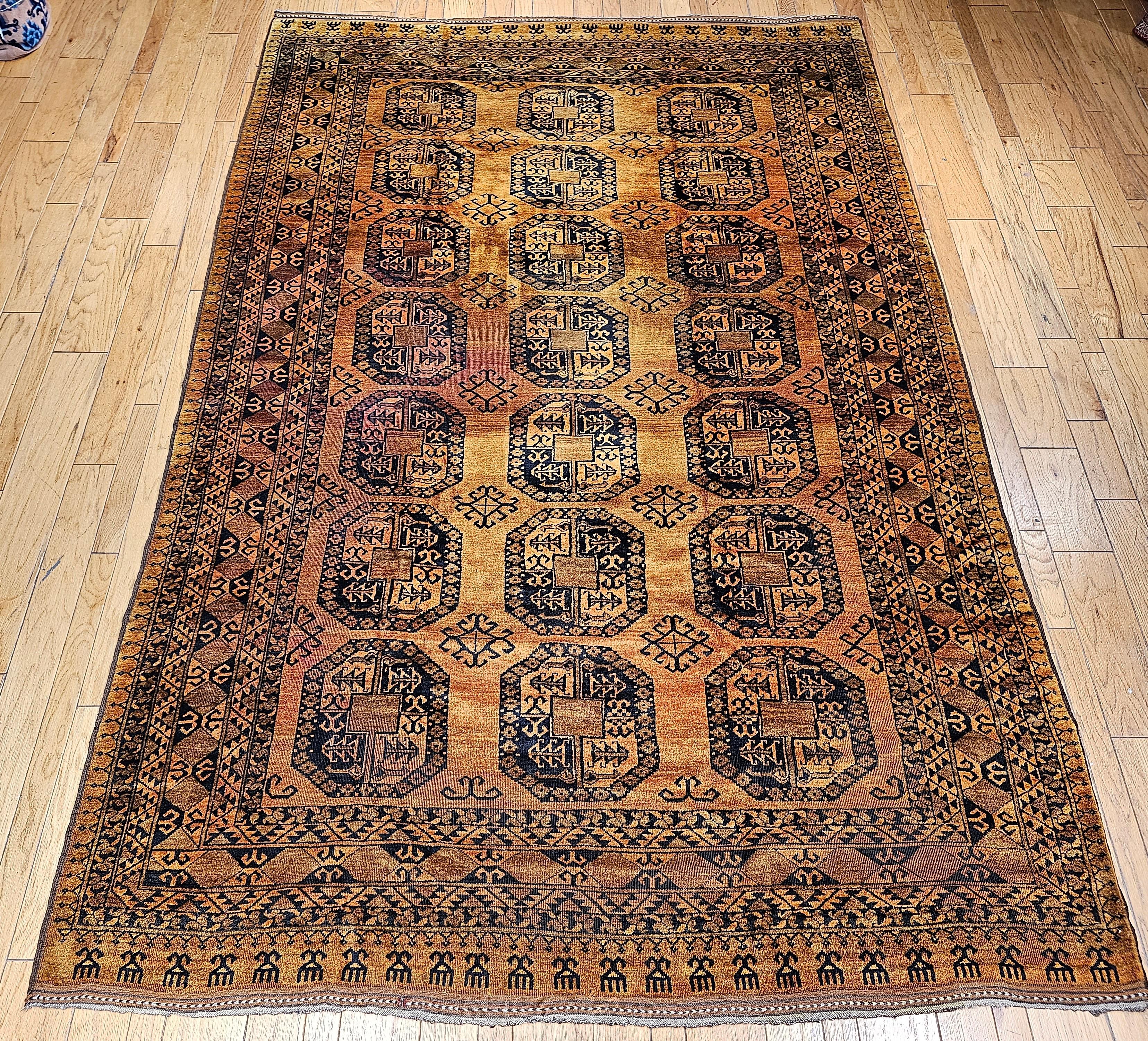A striking vintage Afghan Ersari rug, handwoven in the mid-20th century, featuring an allover geometric 