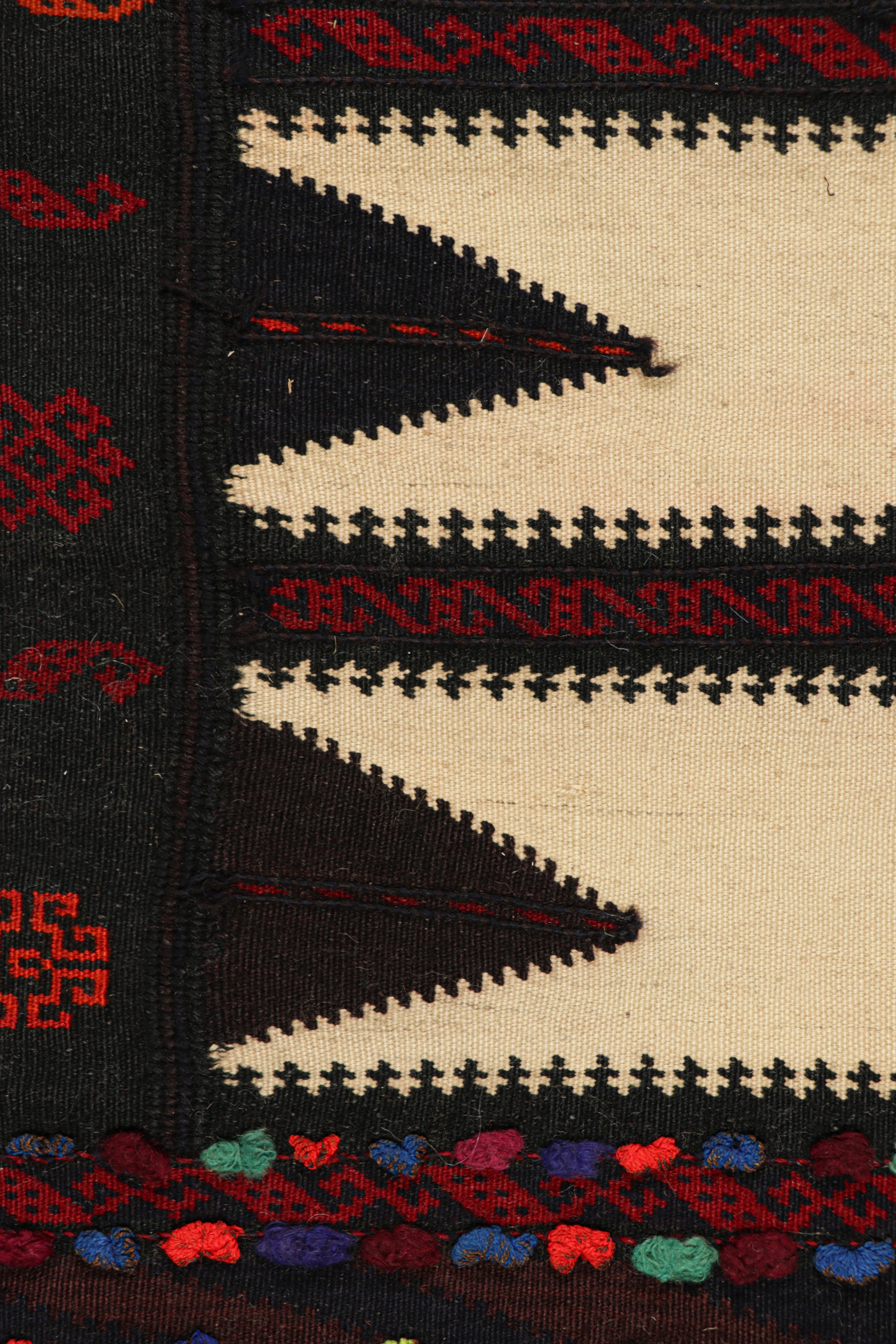Handwoven in wool, circa 1950-1960, this 2×4 vintage Afghan tribal kilim, is a collectible tribal piece that may have been used as table covers in nomadic daily life, much similar to Persian Sofreh Kilims.

On the Design: 

Drawing on Afghan tribal