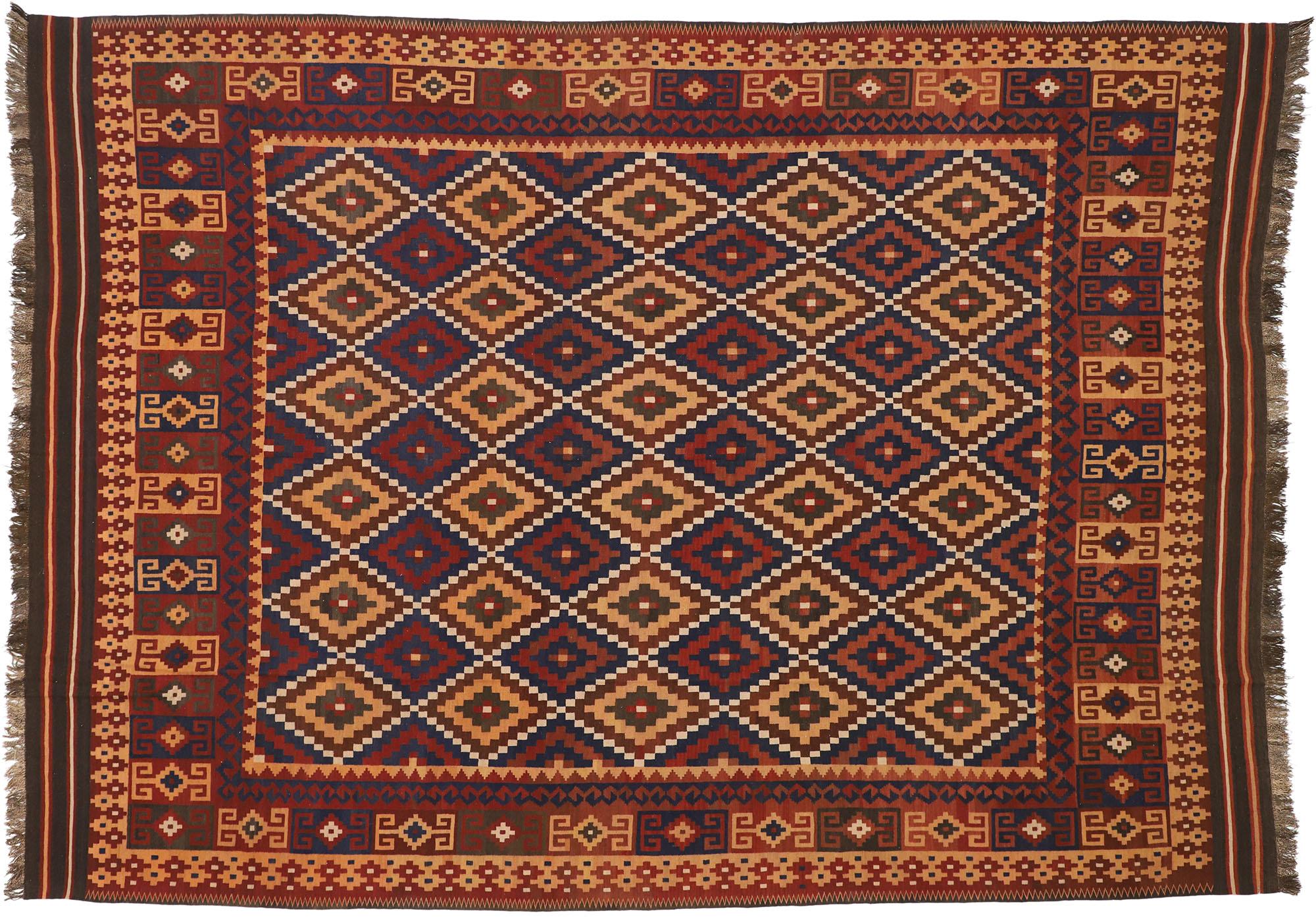 74275 vintage Afghan Kilim rug, 09'08 x 13'04. Full of tiny details and nomadic charm, this hand-woven wool vintage Afghani Maimana kilim rug is a captivating vision of woven beauty. The eye-catching diamond lattice and earthy colorway woven into