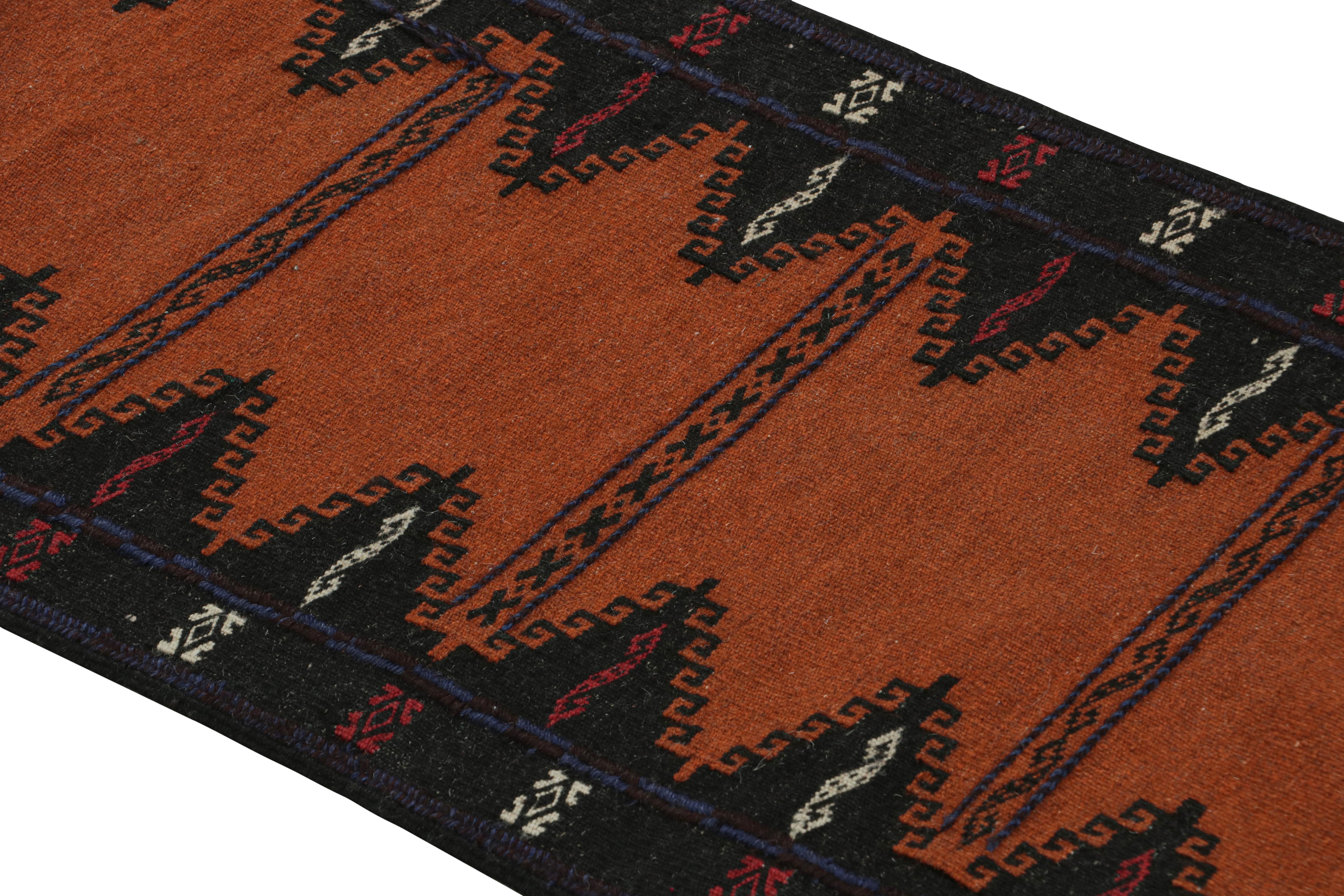 Handwoven in wool, circa 1950-1960, this 2×5 vintage Afghan tribal kilim rug, is a collectible tribal piece that may have been used as table covers in nomadic daily life, much similar to Persian Sofreh Kilims.

On the Design: 

Drawing on Afghan