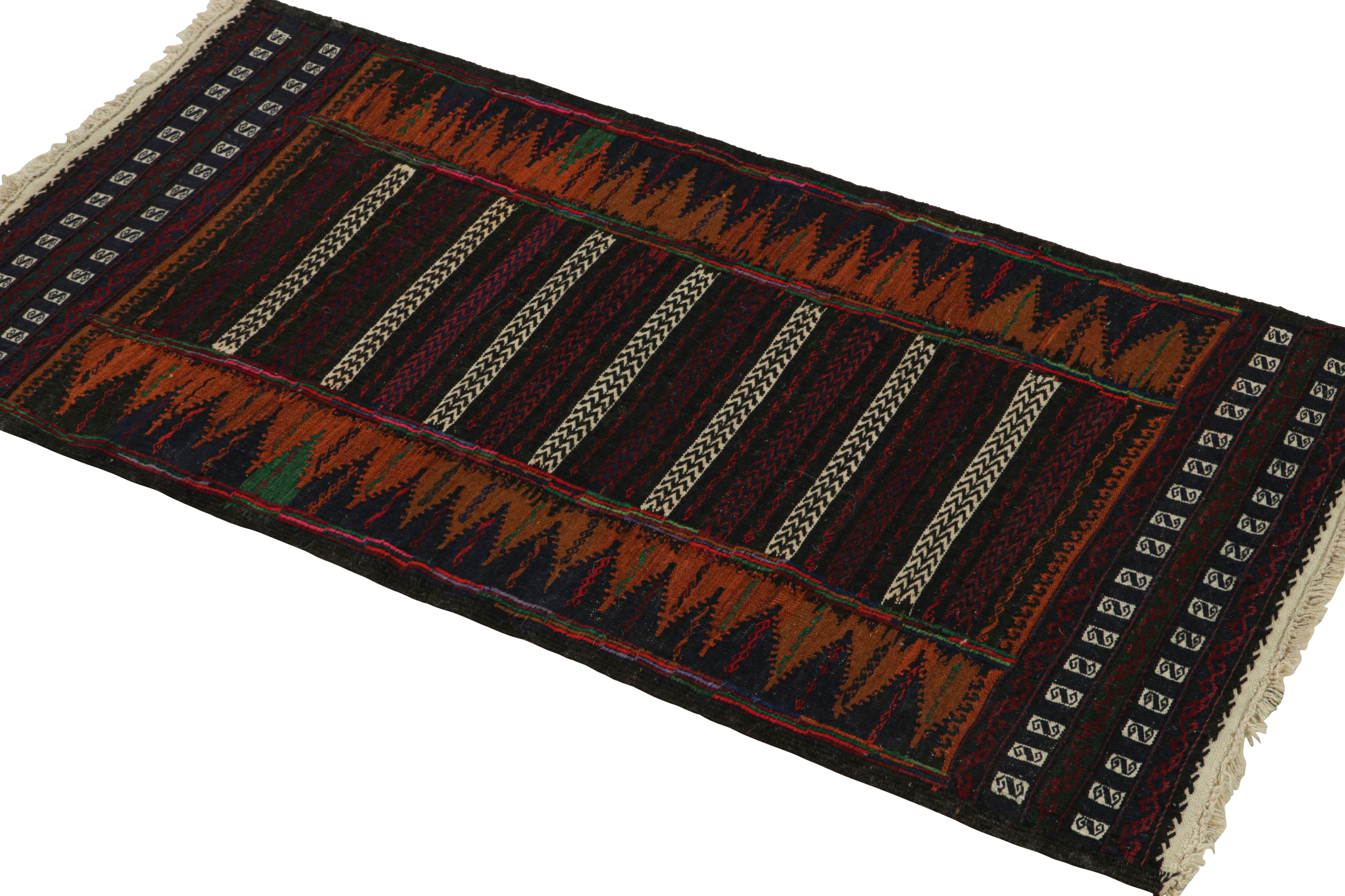 Handwoven in wool, this 2x4 vintage Afghan kilim rug originates circa 1950-1960—a tribal curation among new additions to the Rug & Kilim collection.

On the Design:

A polychromatic colorway with both rich and vibrant hues underscores both stripes