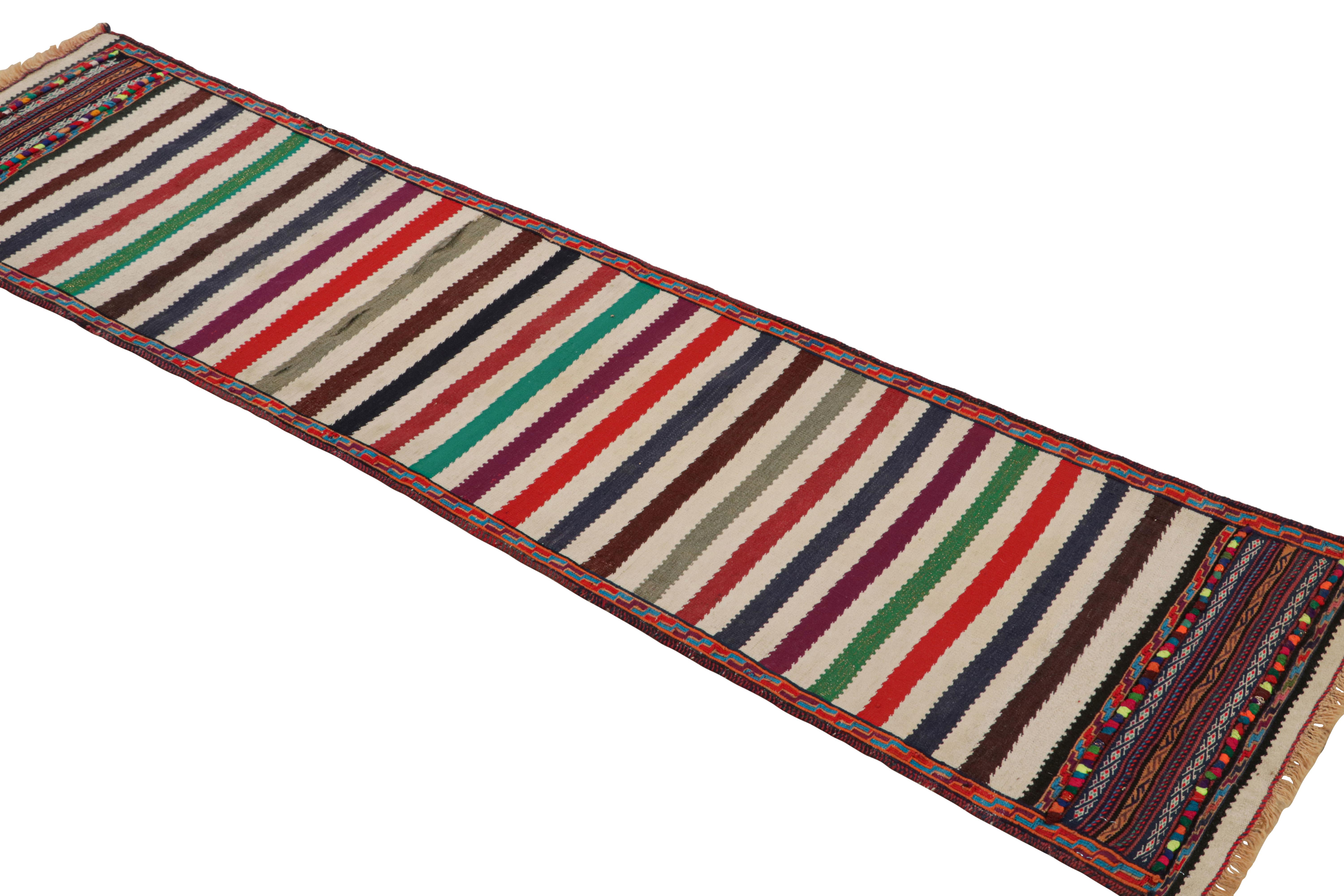 Handwoven in wool, this 1x6 vintage Afghan kilim runner rug originates circa 1950-1960—a tribal curation among new additions to the Rug & Kilim collection.

On the Design:

A polychromatic colorway with both rich and vibrant hues underscores both