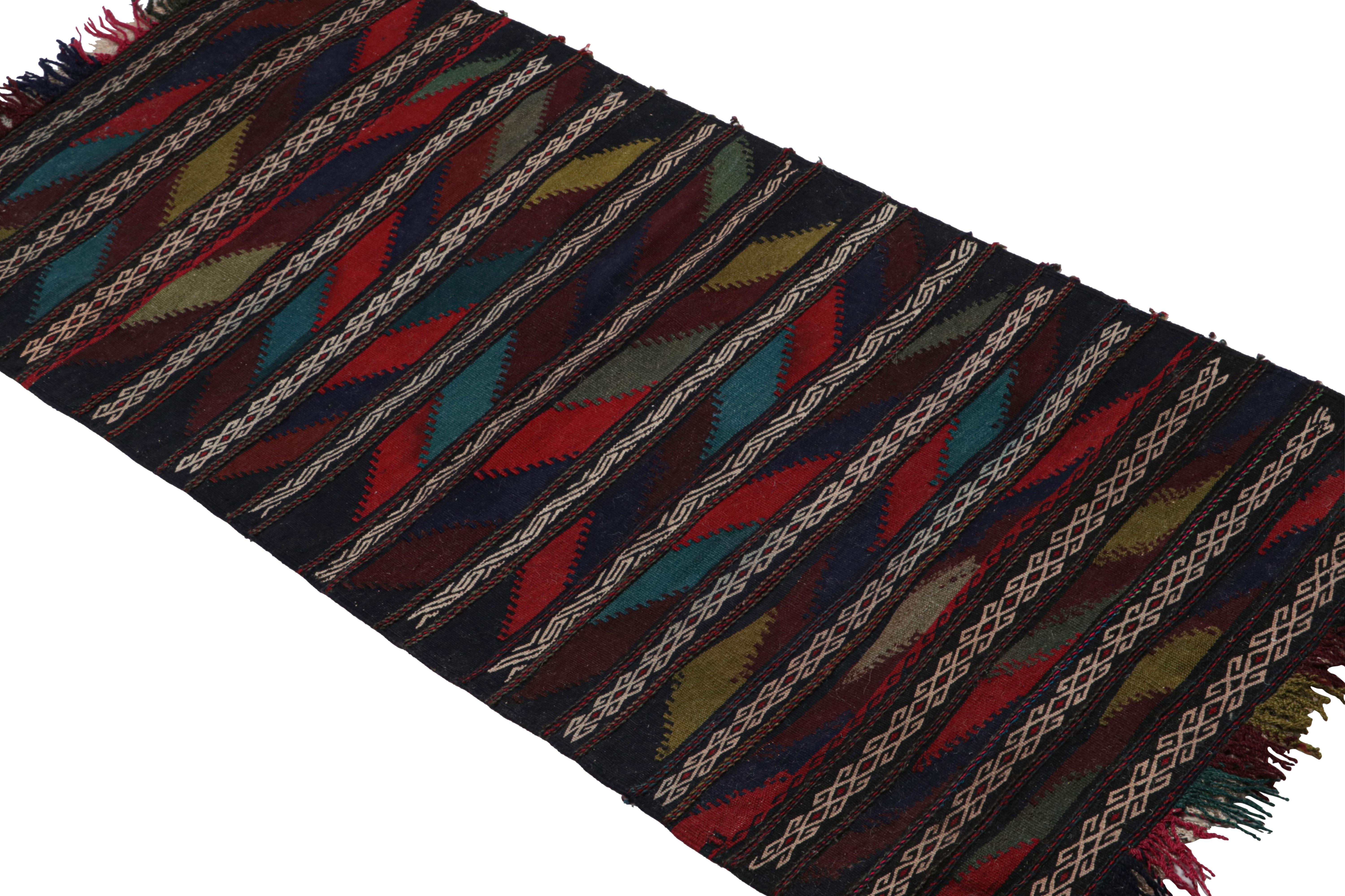 Handwoven in wool circa 1950-1960, this vintage 2x4 Afghan kilim and scatter rug is a new acquisition from Rug & Kilim’s mid-century rugs.

On the Design:

The flatweave depicts geometric patterns in a repeat of diagonals and stripes. Though