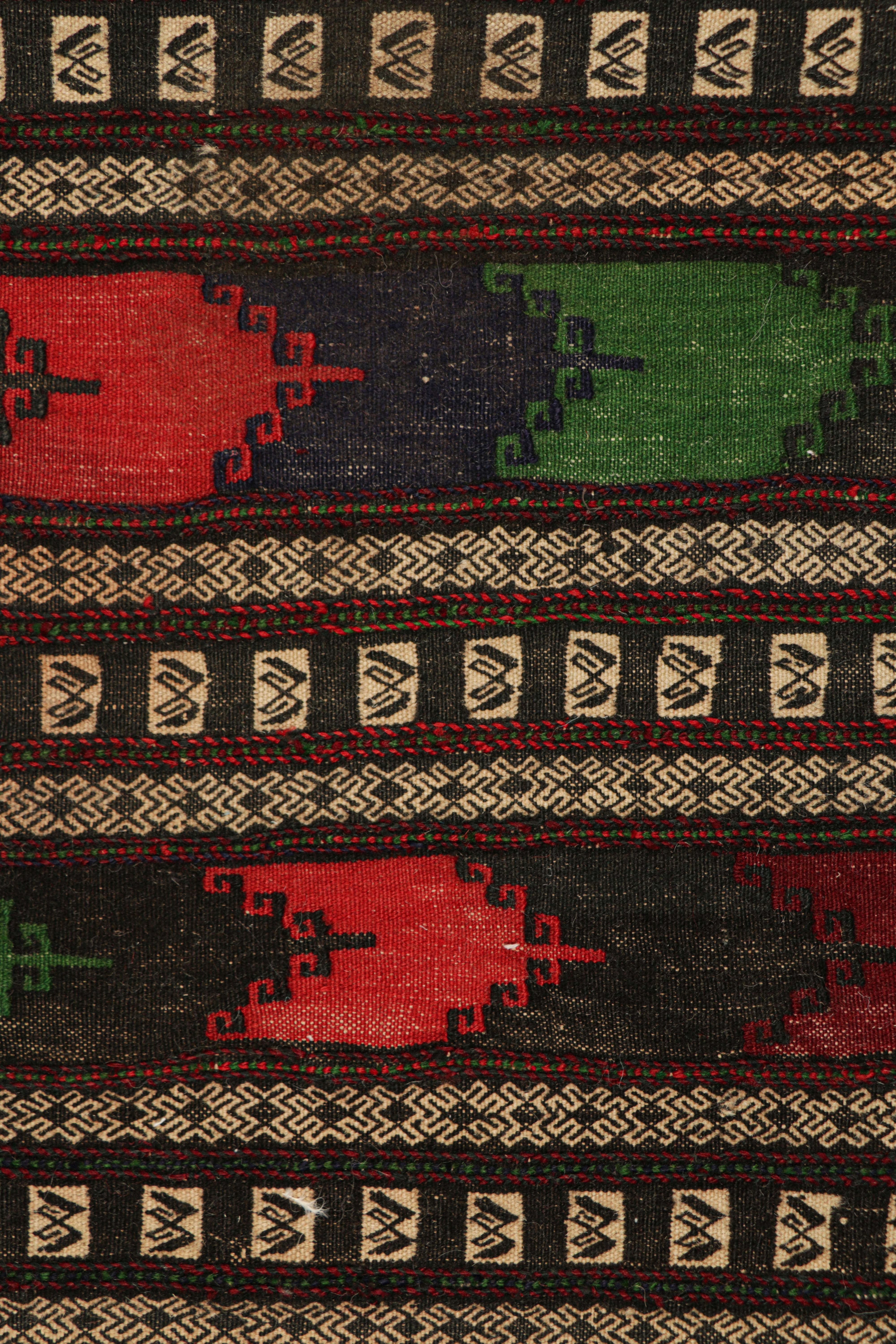 Handwoven in wool, circa 1950-1960, this 2×4 vintage Afghan tribal kilim, is a collectible tribal piece that may have been used as table covers in nomadic daily life, much similar to Persian Sofreh Kilims.

On the Design: 

Drawing on Afghan tribal