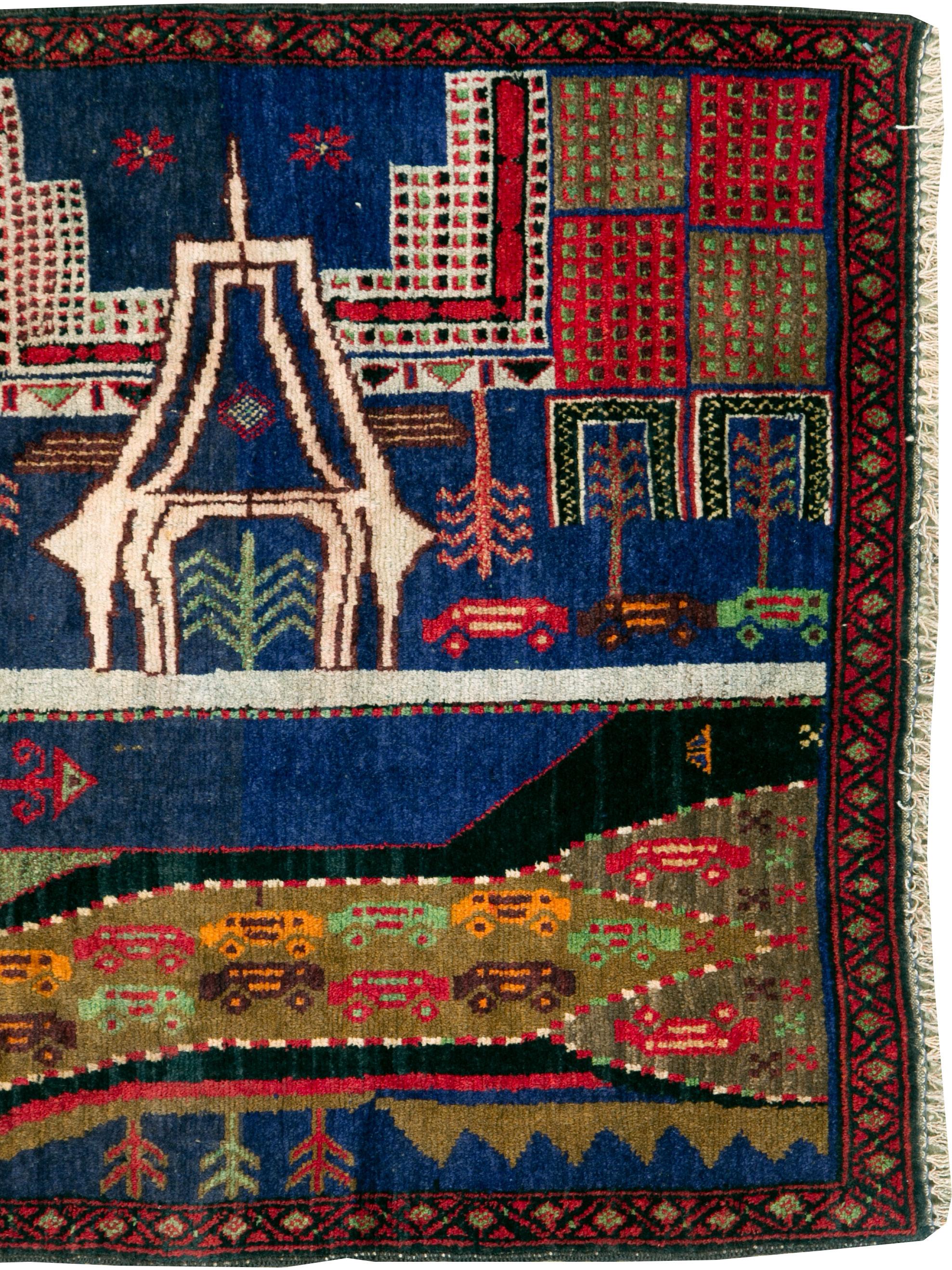 A vintage Afghan Pictorial Baluch rug from the mid-20th century.