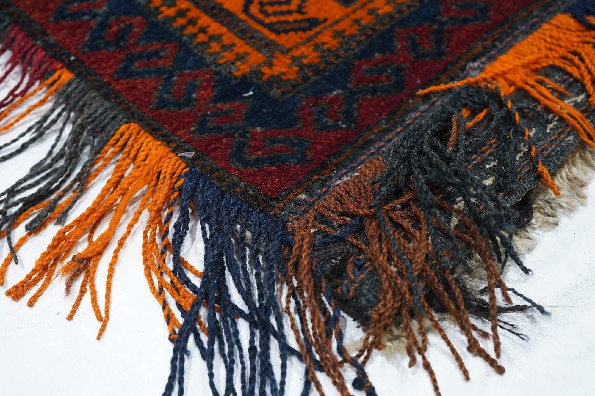Vintage Afghan Rug 1'7'' x 3'2''. The primarily Ersari Turkmen pile tribal carpets of NW Afghanistan, characterized by red fields with repeating medallion (gul) designs, geometric drawing, relatively coarse all wool construction, in all use-types