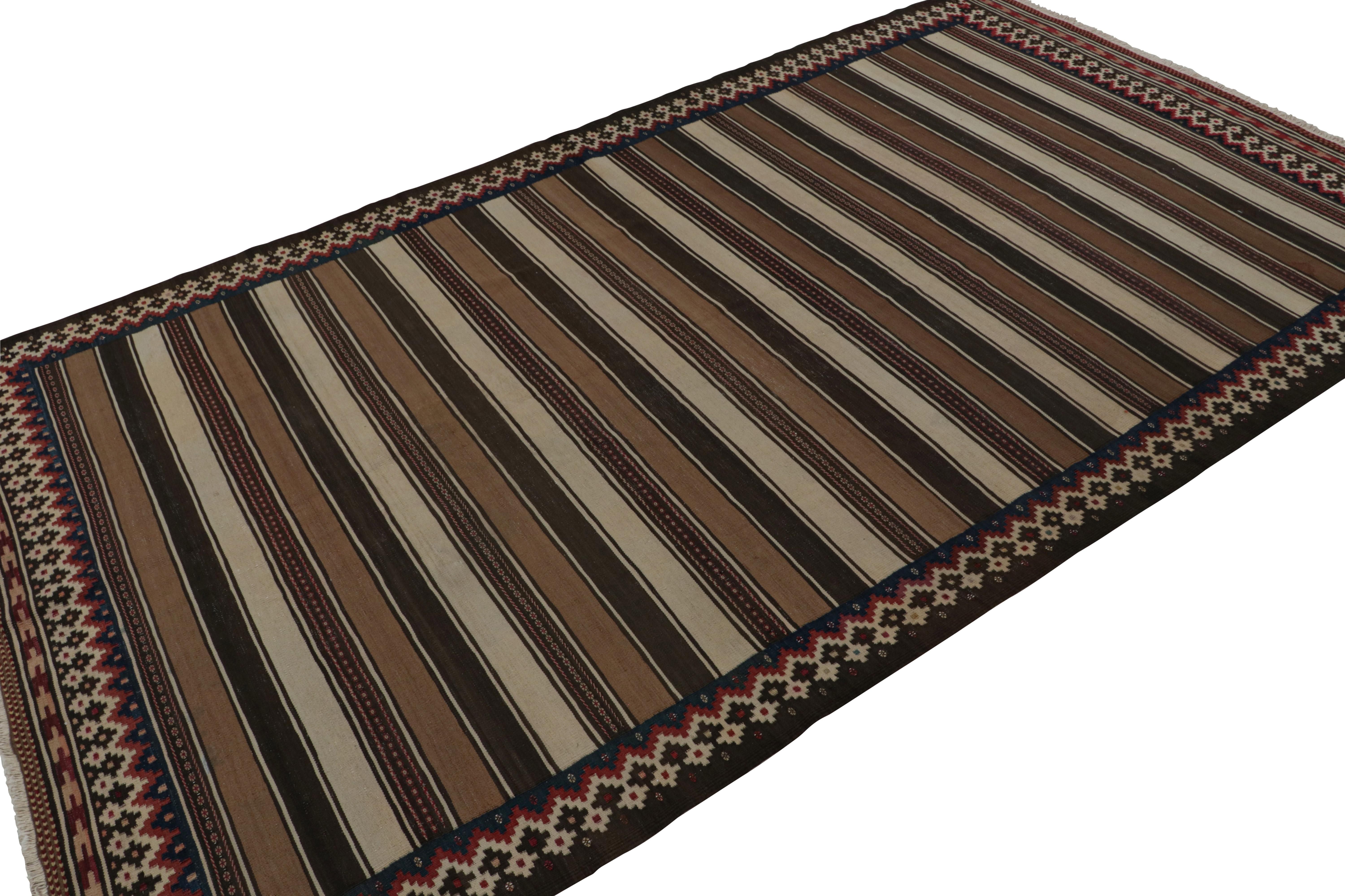 Handwoven in wool, circa 1950-1960, this 6x10 vintage Afghan tribal kilim, in beige/brown, features fencepost geometric patterns across the entire field. 

On the Design: 

As an exciting new curation in Rug & Kilim Collection, this rug in