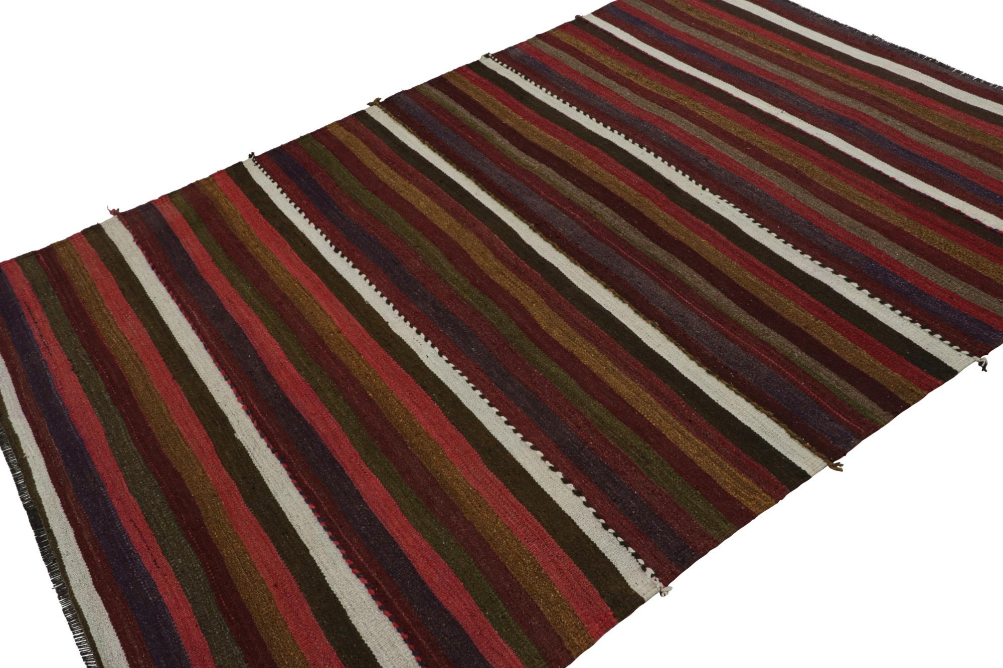 Hand knotted in wool, this 6x9 vintage Afghan tribal kilim rug is an extraordinarily simple piece with colorful stripes and a simple presence. 

On the Design:

As an exciting new curation in Rug & Kilim Collection, this rug  features a series of