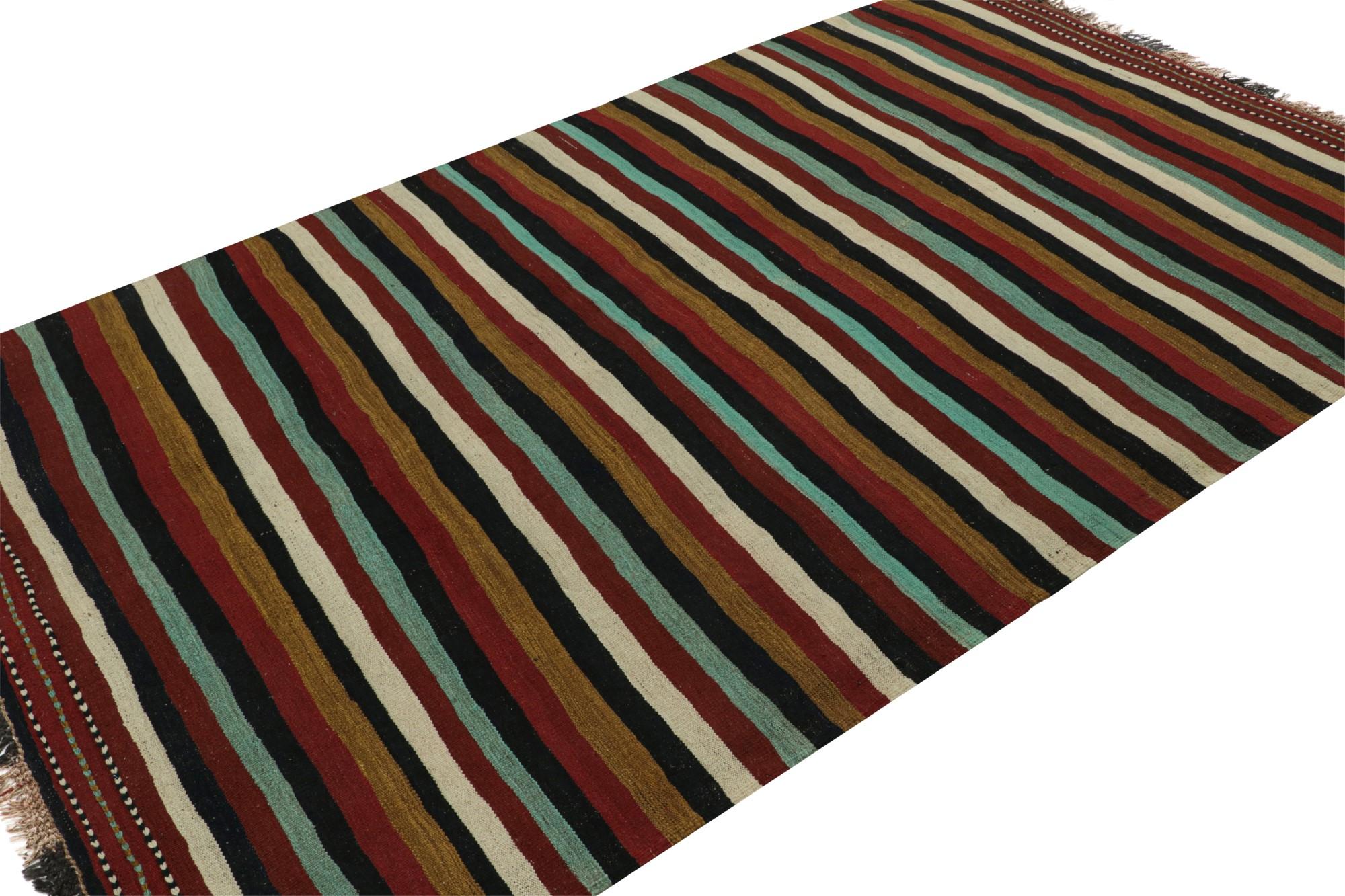 Hand knotted in wool, this 6x10 vintage Afghan tribal kilim rug, originating circa 1950-1960, is an exciting new addition to the Rug & Kilim collection.  

On the design: 

Originating from Afghanistan, this rug is a rich versatile piece reflecting