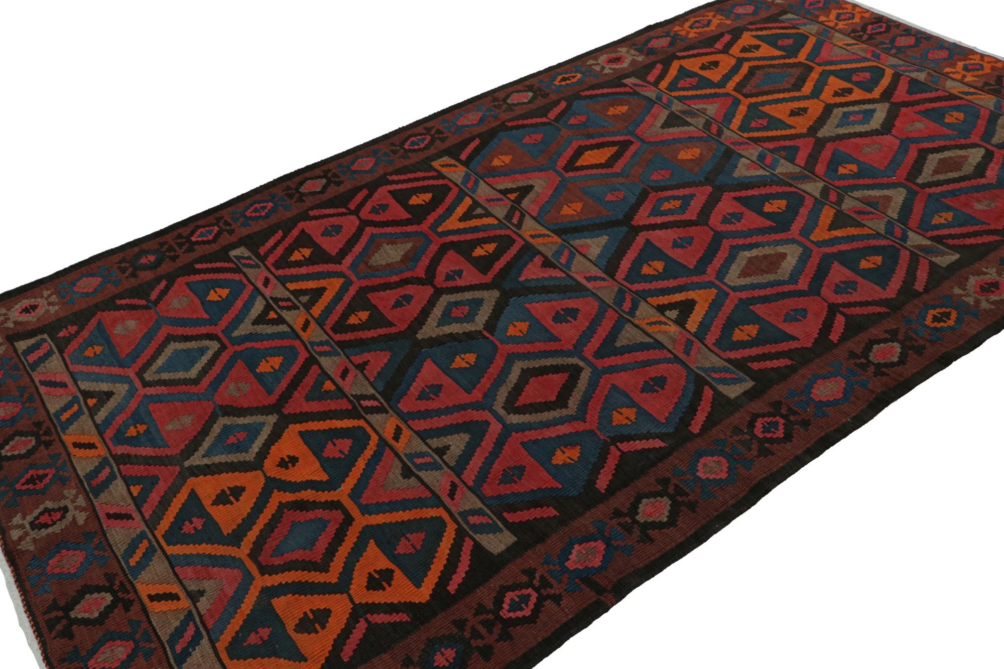Hand knotted in wool, this 5x9 vintage Afghan tribal kilim rug is an extraordinarily simple piece with all over geometric patterns in red, orange, blue and brown, and a simple presence. 

On the Design: 

This flatweave prefers all over geometric