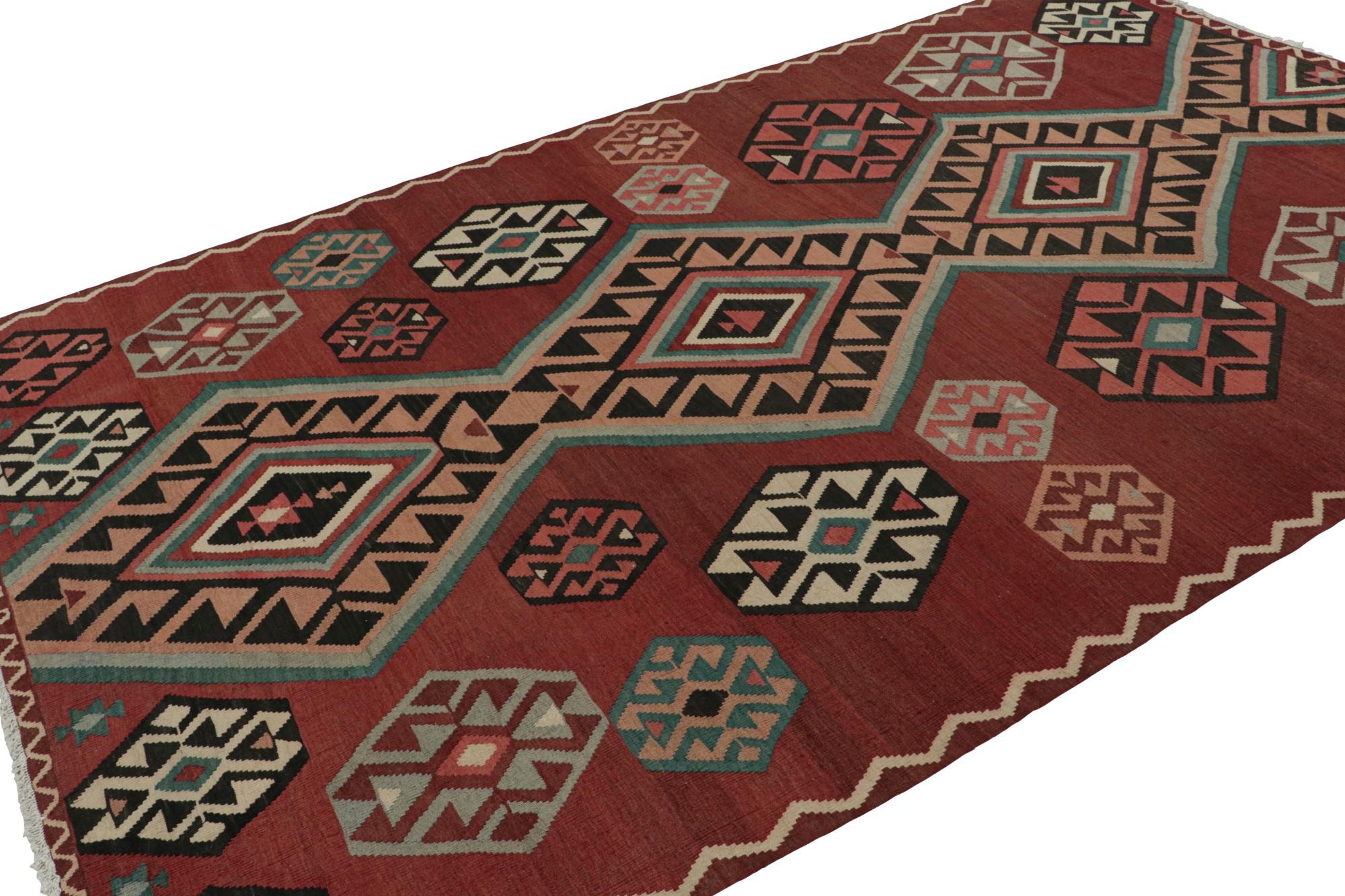 Hand knotted in wool, this 7x12 vintage Afghan tribal kilim rug is an extraordinarily simple piece in red with all over geometric patterns in pink, beige and blue, and a simple presence. 

On the Design: 

The minimalist design prefers all over