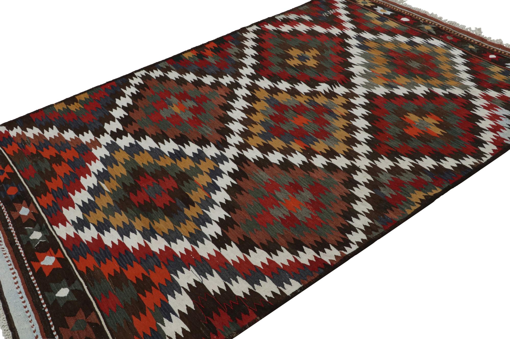 Hand knotted in wool, this 6x9 vintage Afghan tribal kilim rug with its all over geometric patterns, is an extraordinarily addition to the Rug & Kilim Collection. 

On the Design: 

Keen eyes will further admire the finely woven large-scale diamond