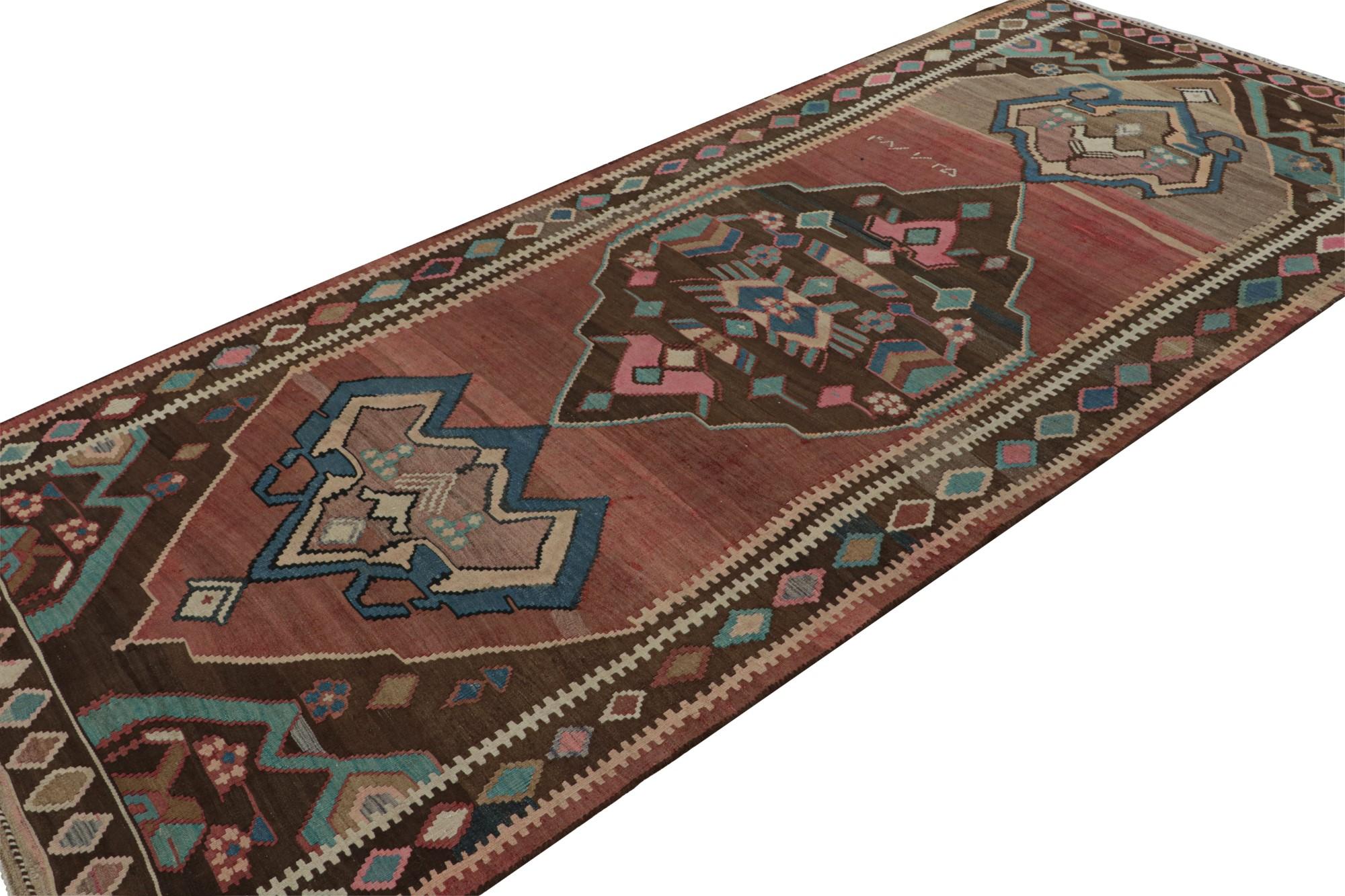 Hand knotted in wool, this 5x12 vintage Afghan tribal kilim rug originating circa 1950-1960, with its all over geometric patterns, is a very special addition to the Rug & Kilim collection. 

On the Design: 

This design enjoys rich medallions on a