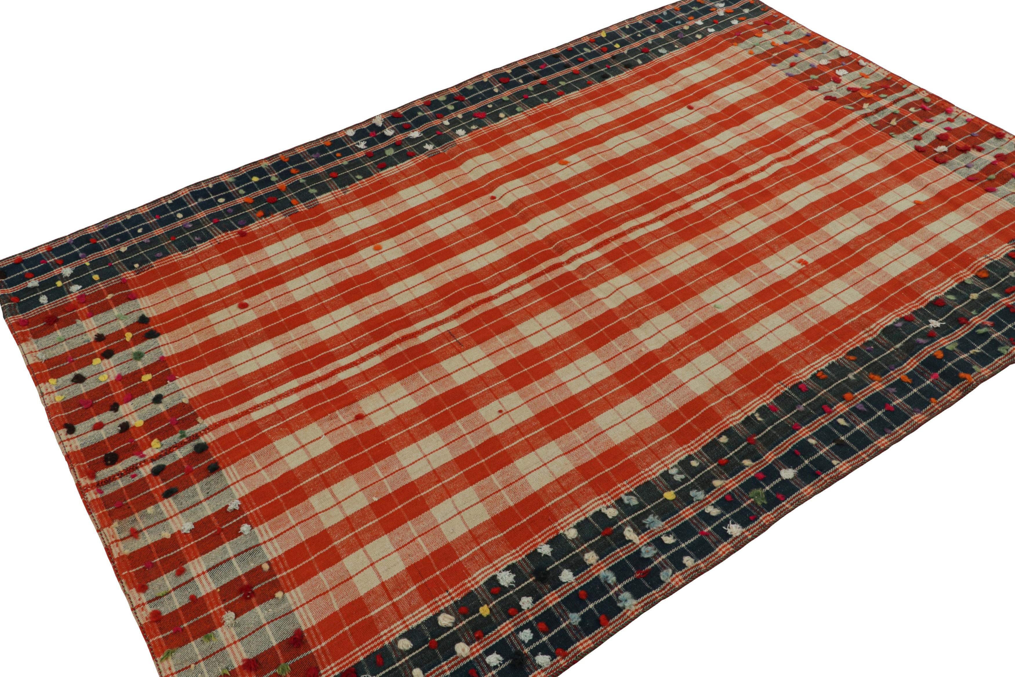 Featuring a colorway of red, blue and off-white, this 5x7 vintage Afghan tribal kilim rug, handwoven in wool, circa 1950-1960, features plaid-like play of stripes and geometric patterns, with a Persian influence. 

On the Design: 

A new curation