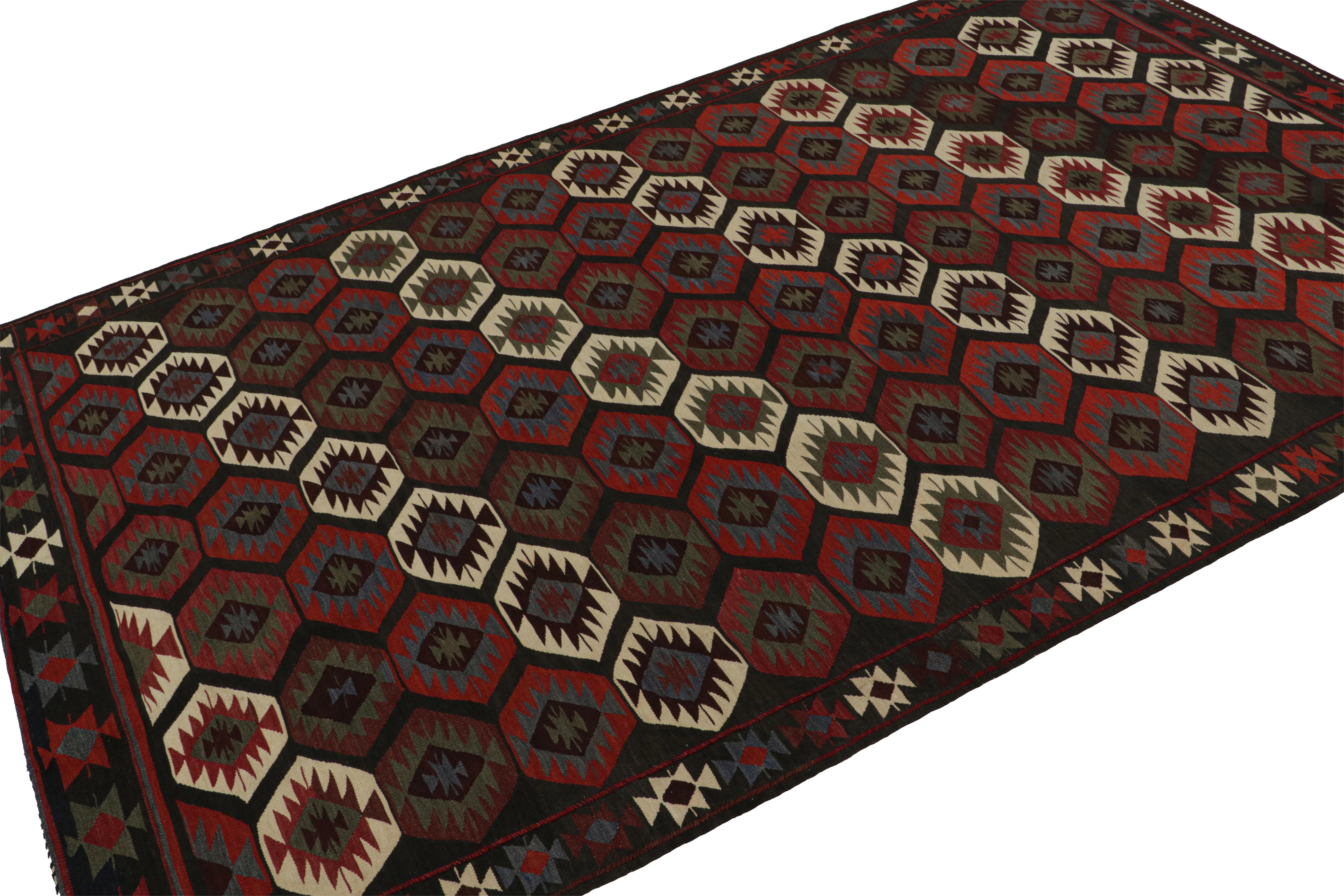 This vintage 5x9 Persian Kilim is a mid-century tribal rug - latest to join our Kilim & Flatweave collection. 

On the Design:

Handwoven in wool circa 1950-1960, the flatweave enjoys tribal patterns in red & blue. Keen eyes will note subtle color