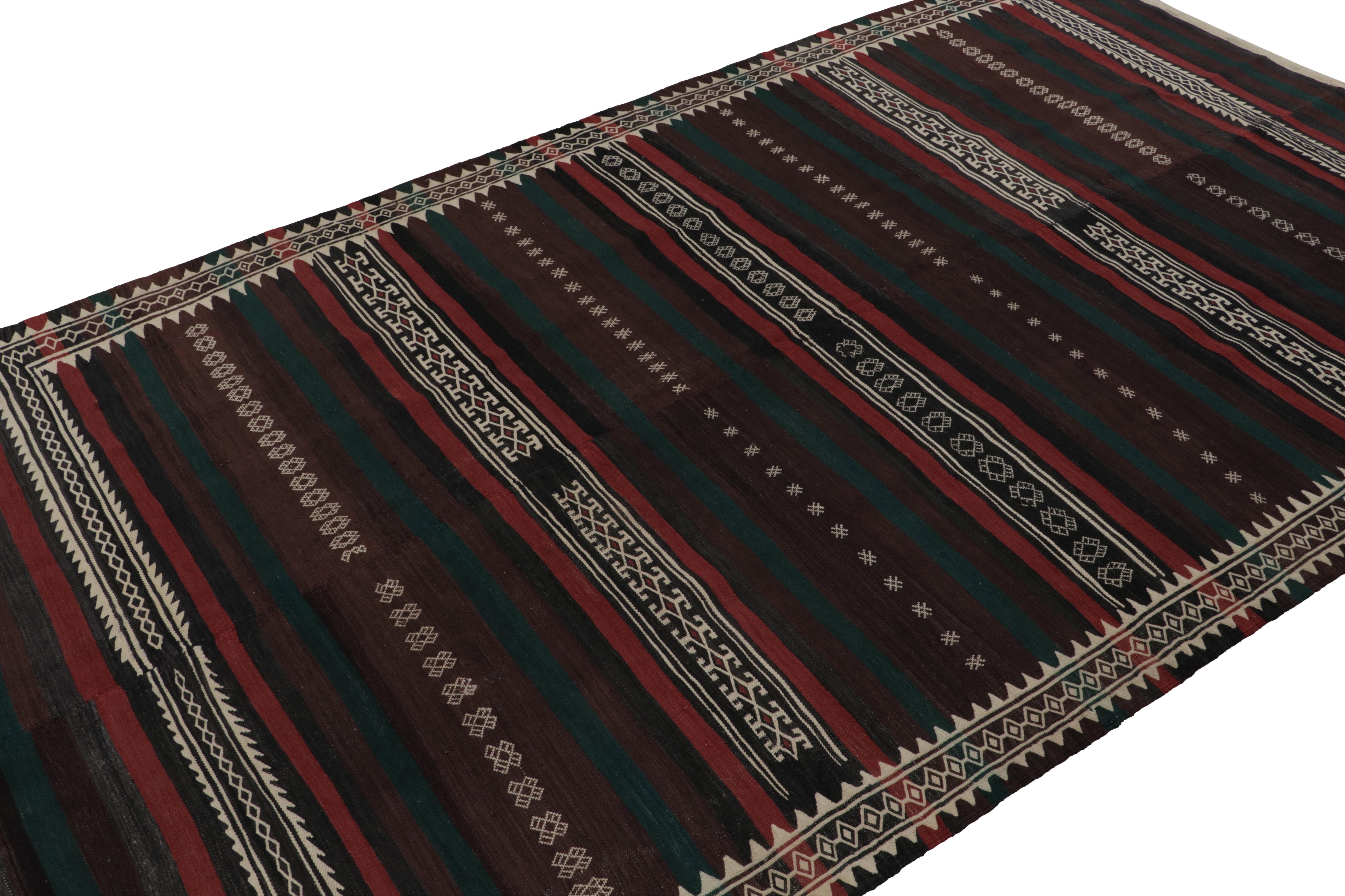 This vintage 6x10 Persian Kilim is a mid-century tribal rug - latest to join our Kilim & Flatweave collection. 

On the Design:

Handwoven in wool circa 1950-1960, the flatweave enjoys tribal patterns in red & brown. The color variations blend