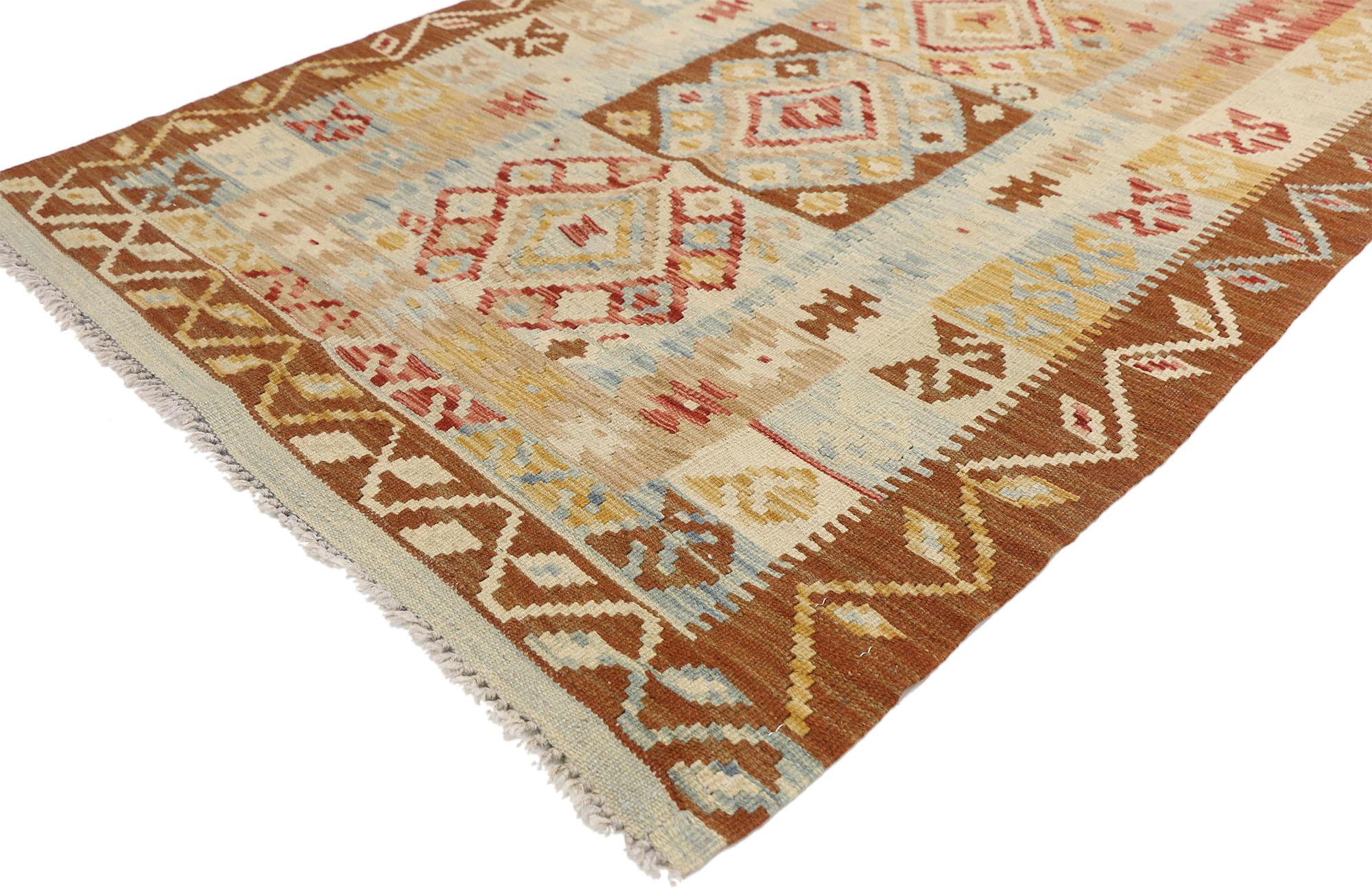 80134 Vintage Afghani Kilim rug, 03'03 x 05'05. Full of tiny details and nomadic charm, this handwoven wool vintage Afghan kilim rug is a captivating vision of woven beauty. The eye-catching tribal design and vibrant earth-tone colors woven into