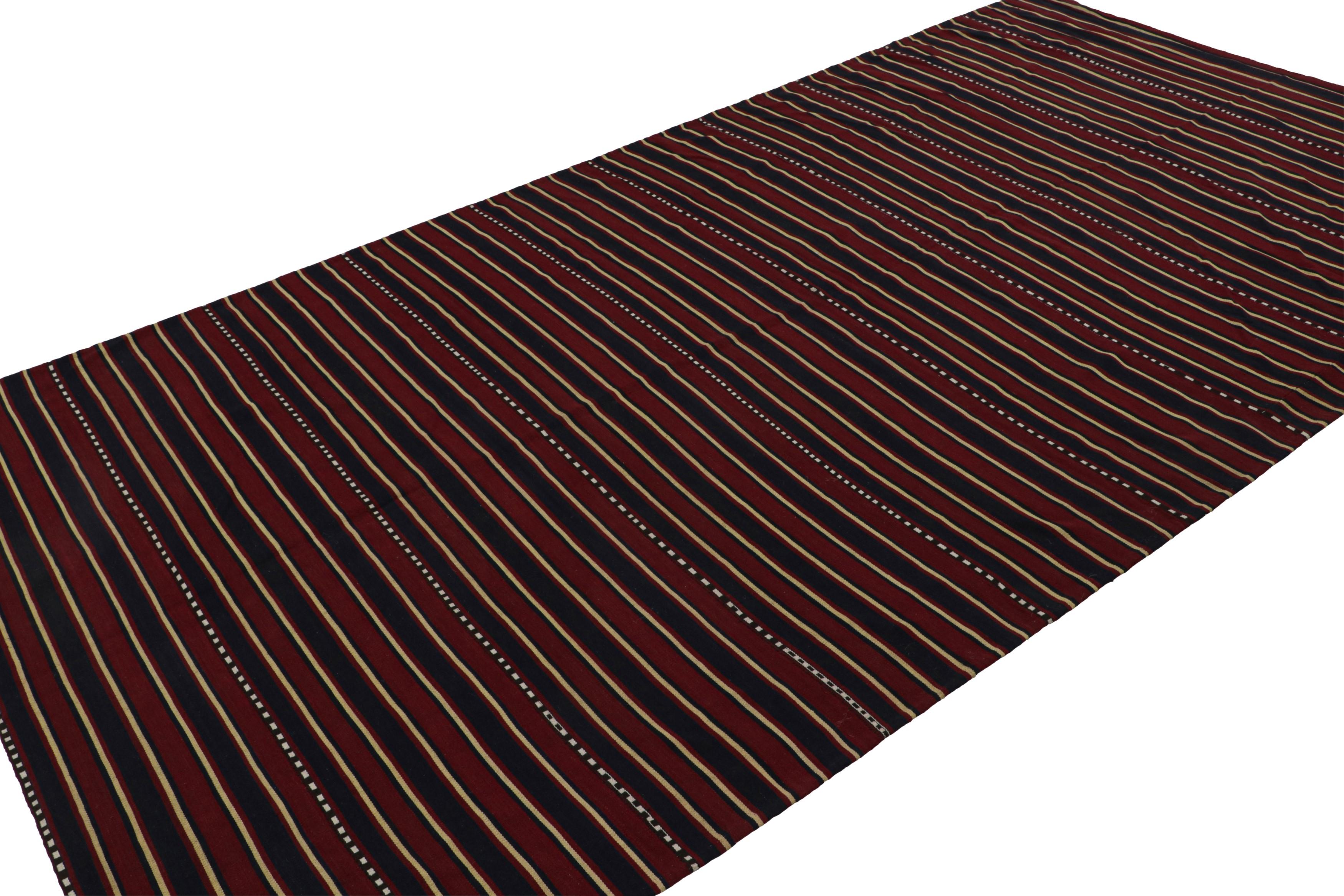 Handwoven in wool, circa 1950-1960, this 6x11 vintage Afghan tribal kilim rug, with horizontal stripes, features quintessential colors of this provenance, done masterfully in saturated tones and simple repeat. 

On the Design:

 Featuring repetitive
