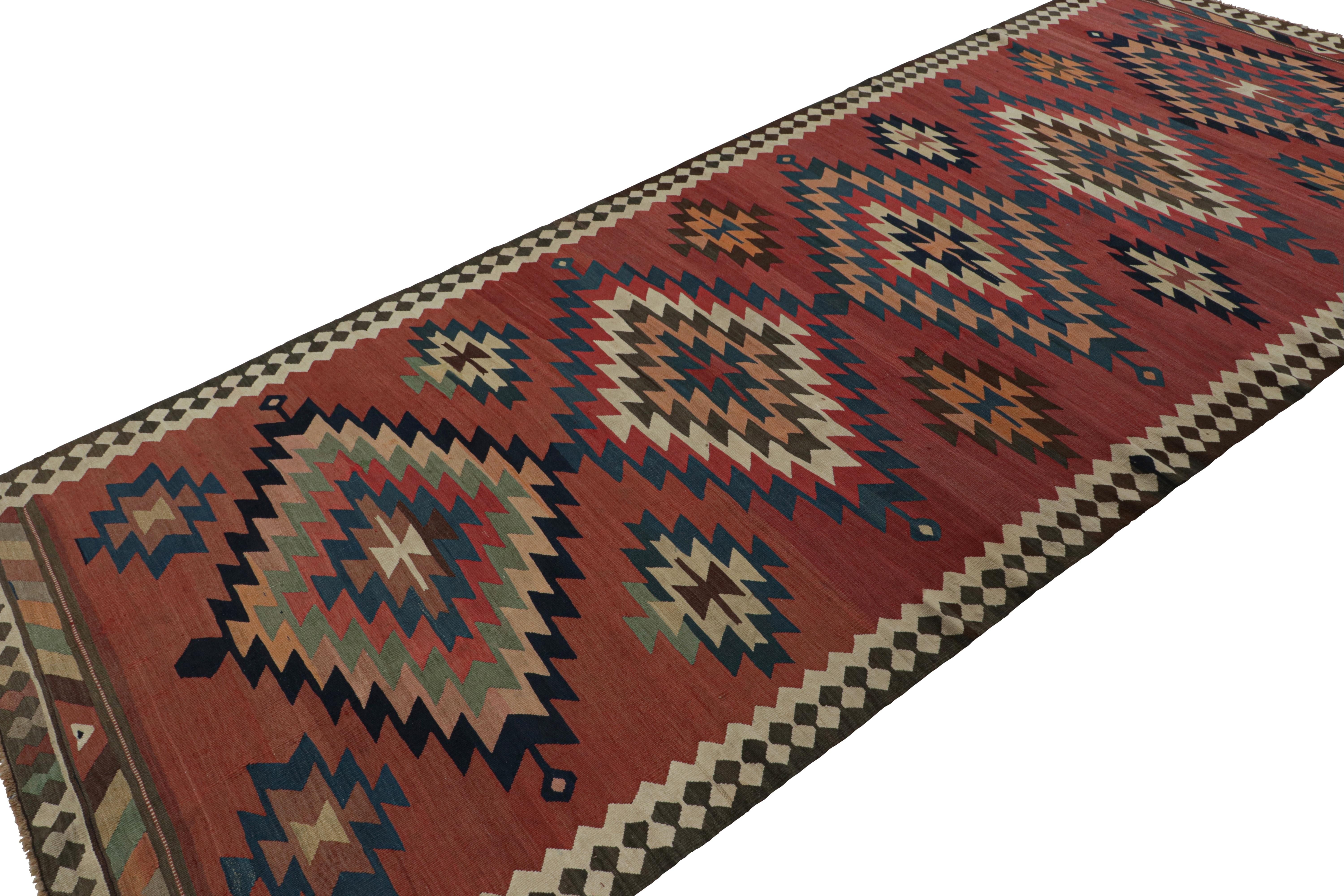 Handwoven in wool, circa 1950-1960, this 5x13 Afghani tribal Kilim rug, with large medallions, is a special curation in the Rug & Kilim collection. 

On the design: 

A special piece in the Rug & Kilim collection given its rare quality, this rug