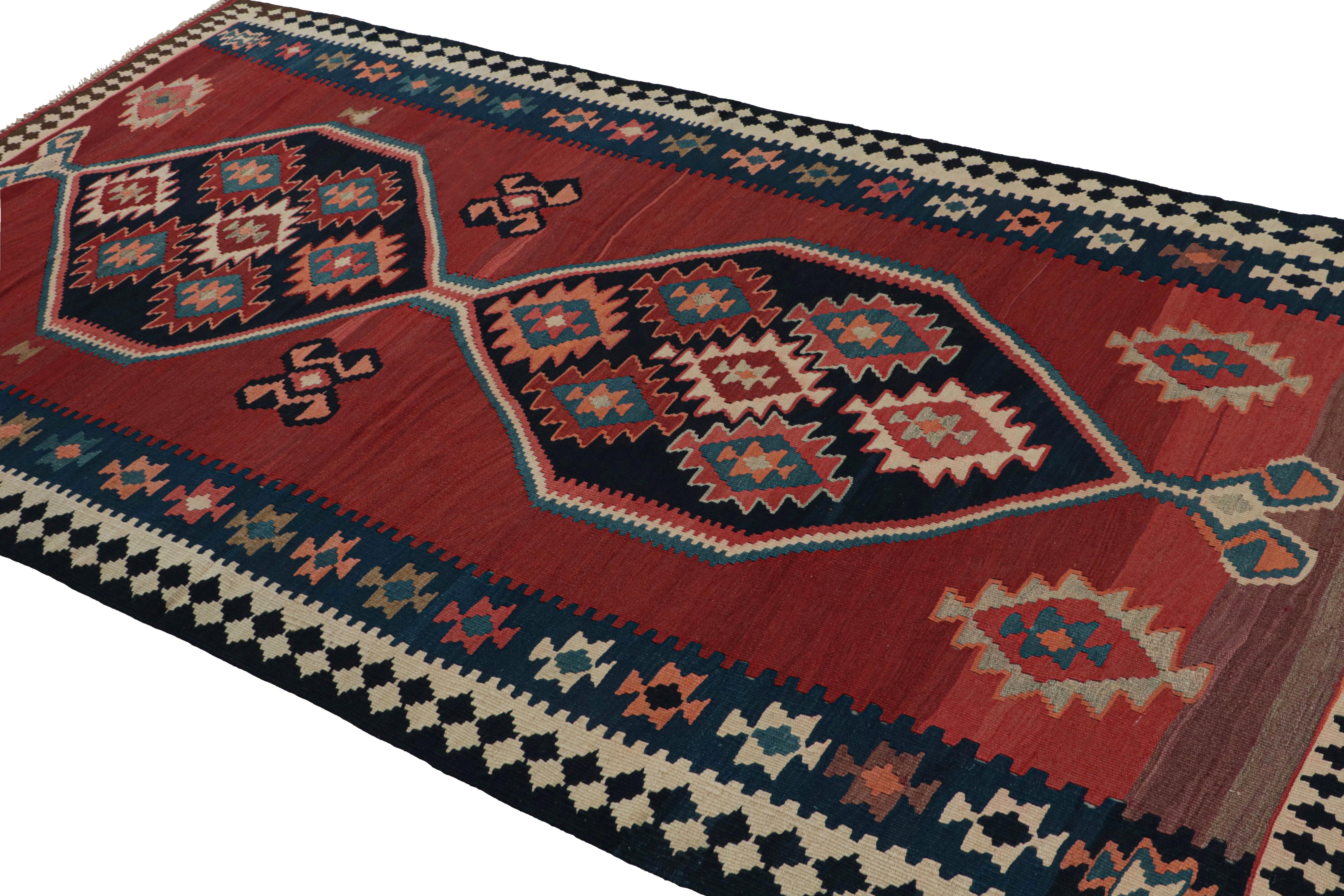 Handwoven in wool, circa 1950-1960, this 5x10 Afghani tribal Kilim rug, with medallion and open field style together, is a special curation in the Rug & Kilim collection. 

On the Design: 

A special piece in the Rug & Kilim collection, this rug