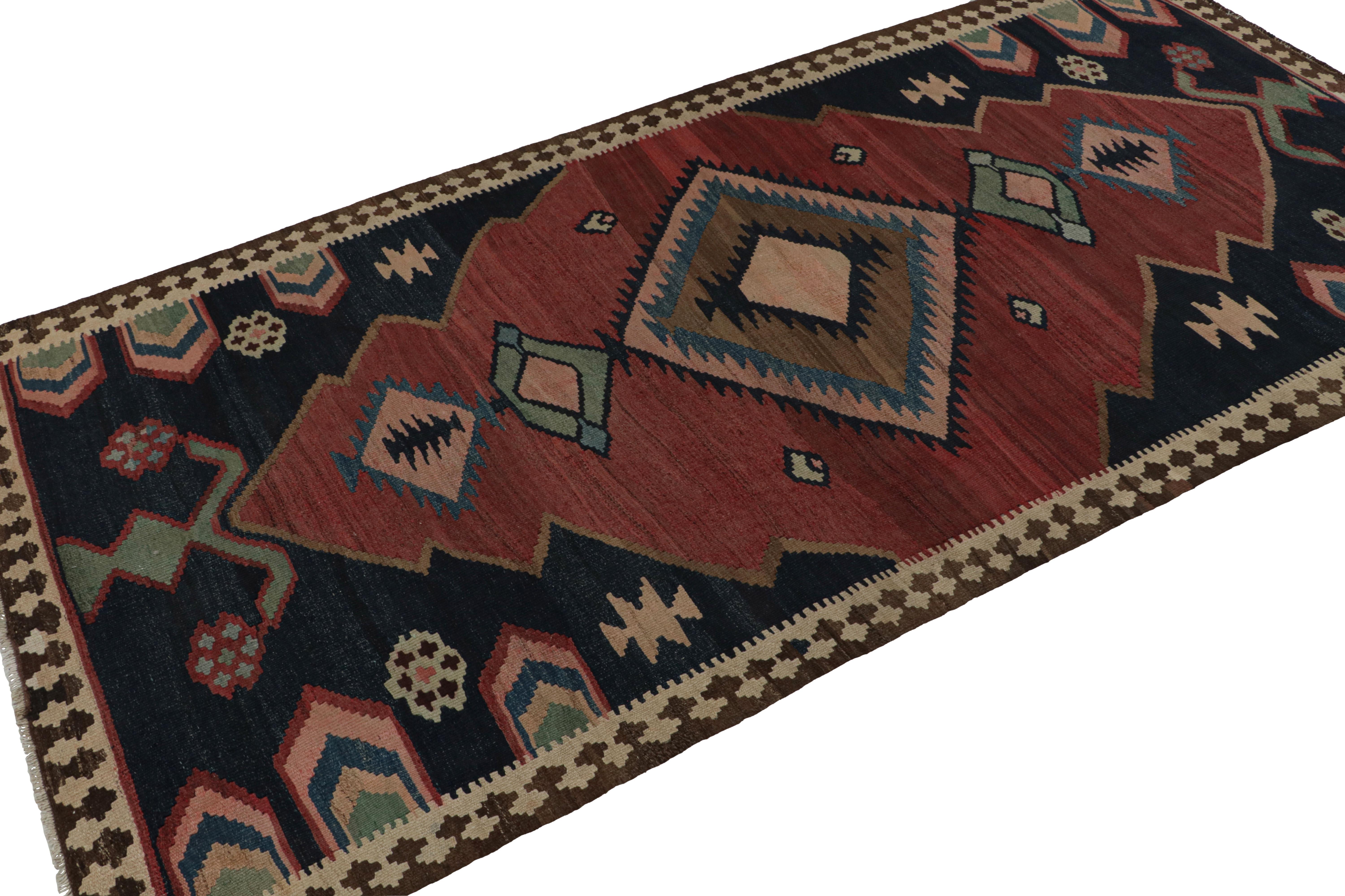 Handwoven in wool, circa 1950-1960, this 5x10 Afghani tribal Kilim rug, with medallion and open field style together, is a special curation in the Rug & Kilim collection. 

On the Design: 

A special piece in the Rug & Kilim collection, this rug