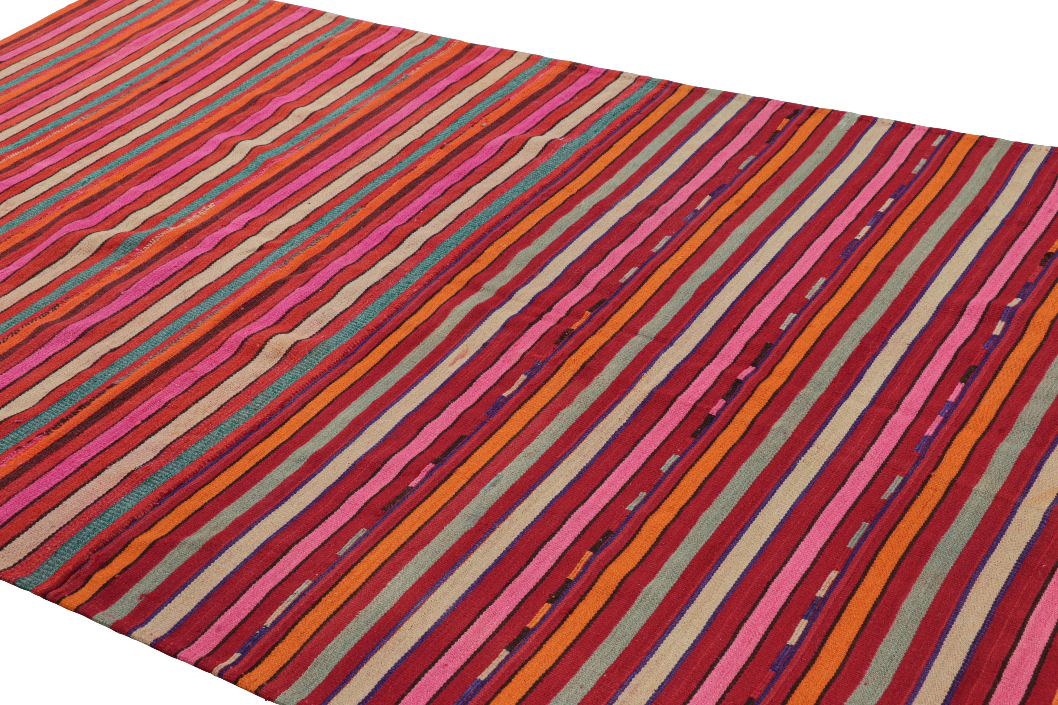 Handwoven in wool, this 6x11 vintage Afghan tribal kilim is an exciting new curation in Rug & Kilim’s coveted Vintage collection. 

On the Design: 

This flatweave hosts an all over striped pattern in polychromatic colorways favoring red, pink,