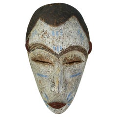 Masque africain vintage en bois de baoule des années 1940