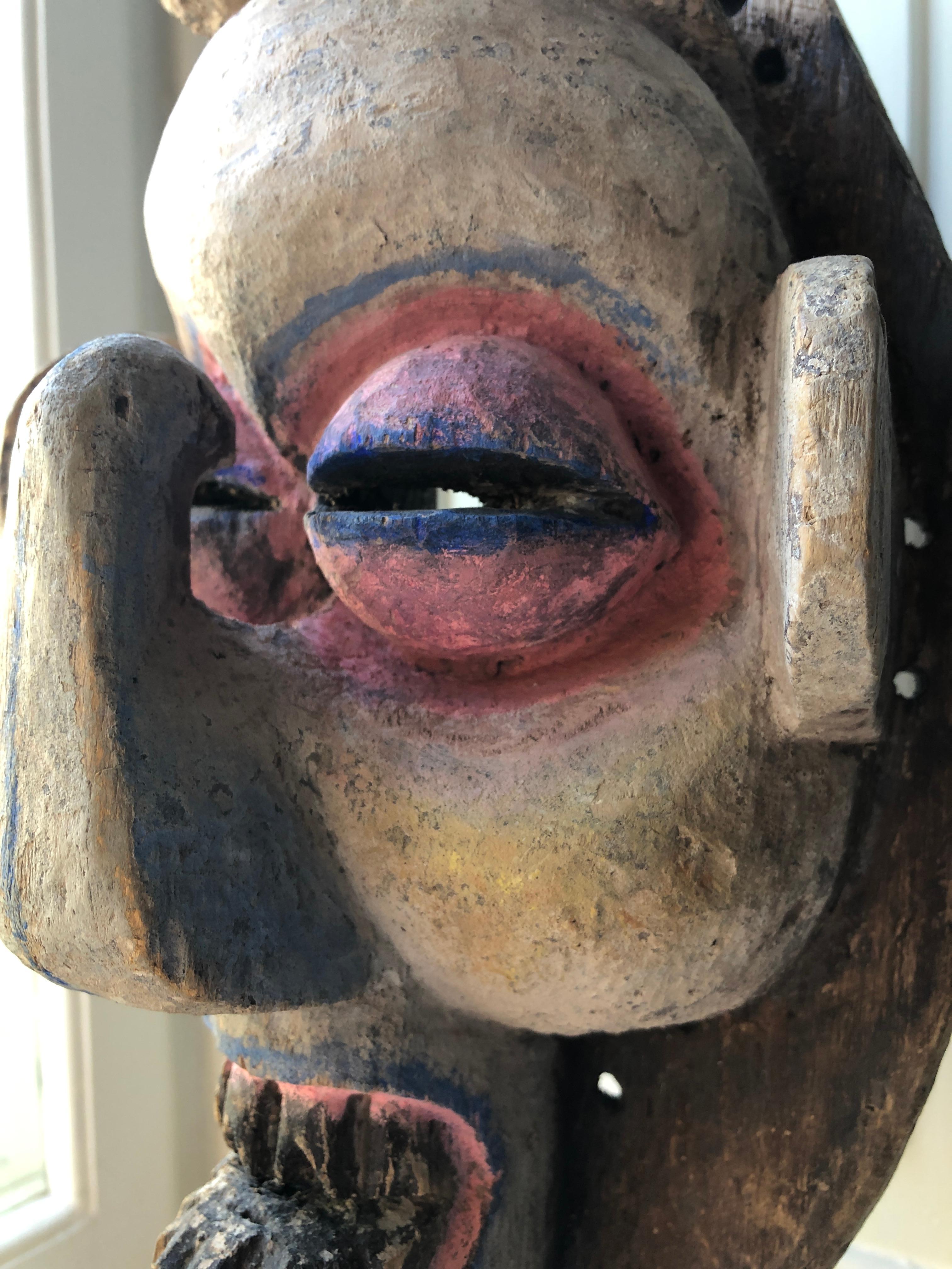 Vintage African 1950s Wooden Mask on Stand and Painted in Pink and Blue 1