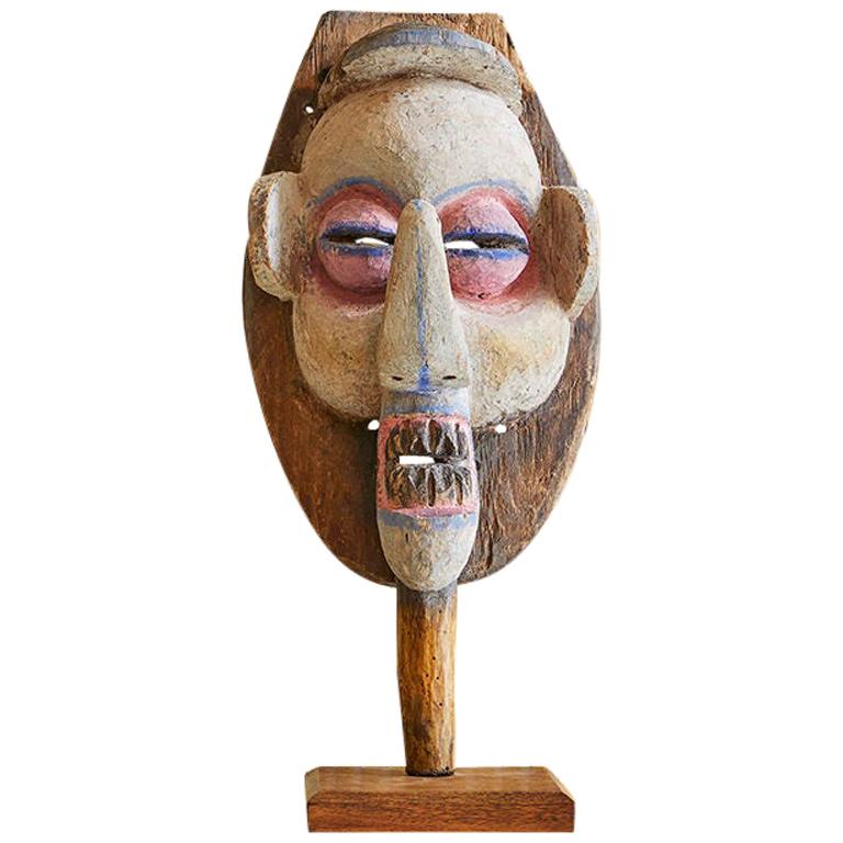 Vintage African 1950s Wooden Mask on Stand and Painted in Pink and Blue