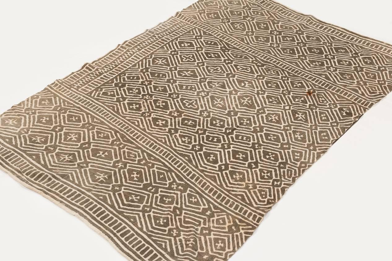 This mud cloth was made, circa 1980s and was made from handwoven strips of cotton. This mud cloth comes from Mali and made by the Bamana tribe. The cotton is very soft. The pattern has intriguing subtle changes throughout that are not apparent at