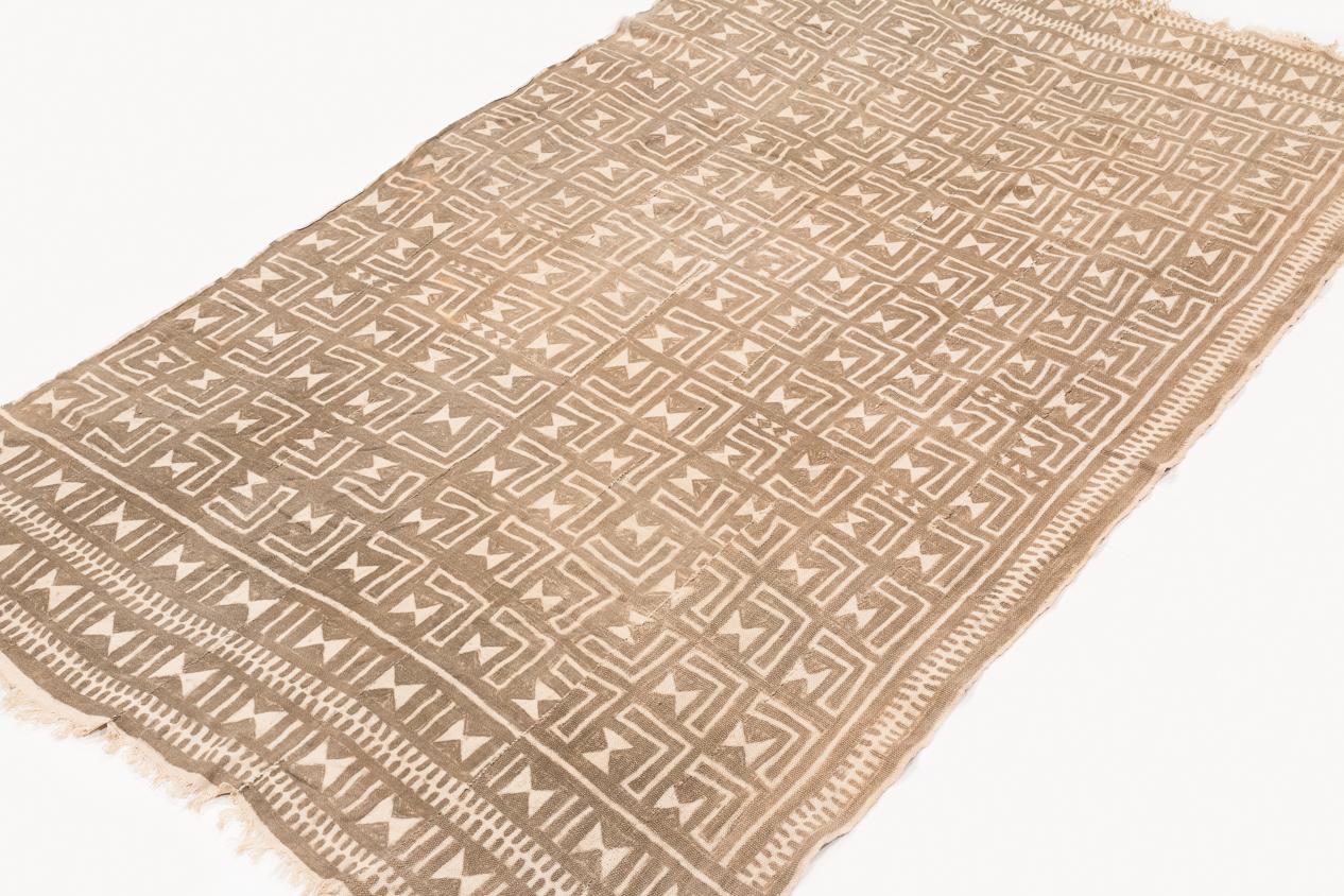 This mud cloth was made and was made from handwoven strips of cotton, circa 1980s. This mud cloth comes from Mali and made by the Bamana tribe. The cotton is very soft. The pattern has intriguing subtle changes throughout that are not apparent at