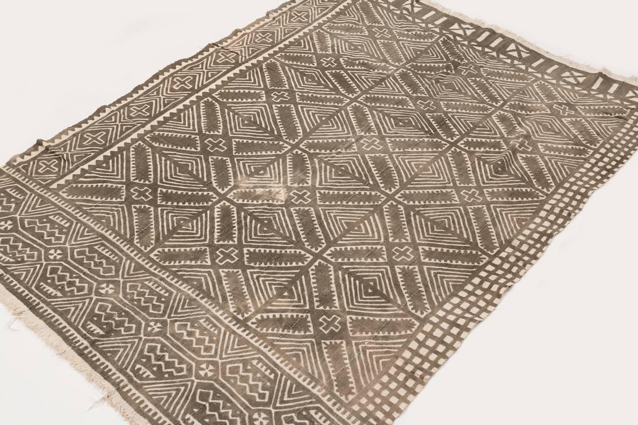 This mud cloth was made circa 1980s and was made from handwoven strips of cotton. This mud cloth comes from Mali and made by the Bamana tribe. The cotton is very soft. The pattern has intriguing subtle changes thru-out that are not apparent at first