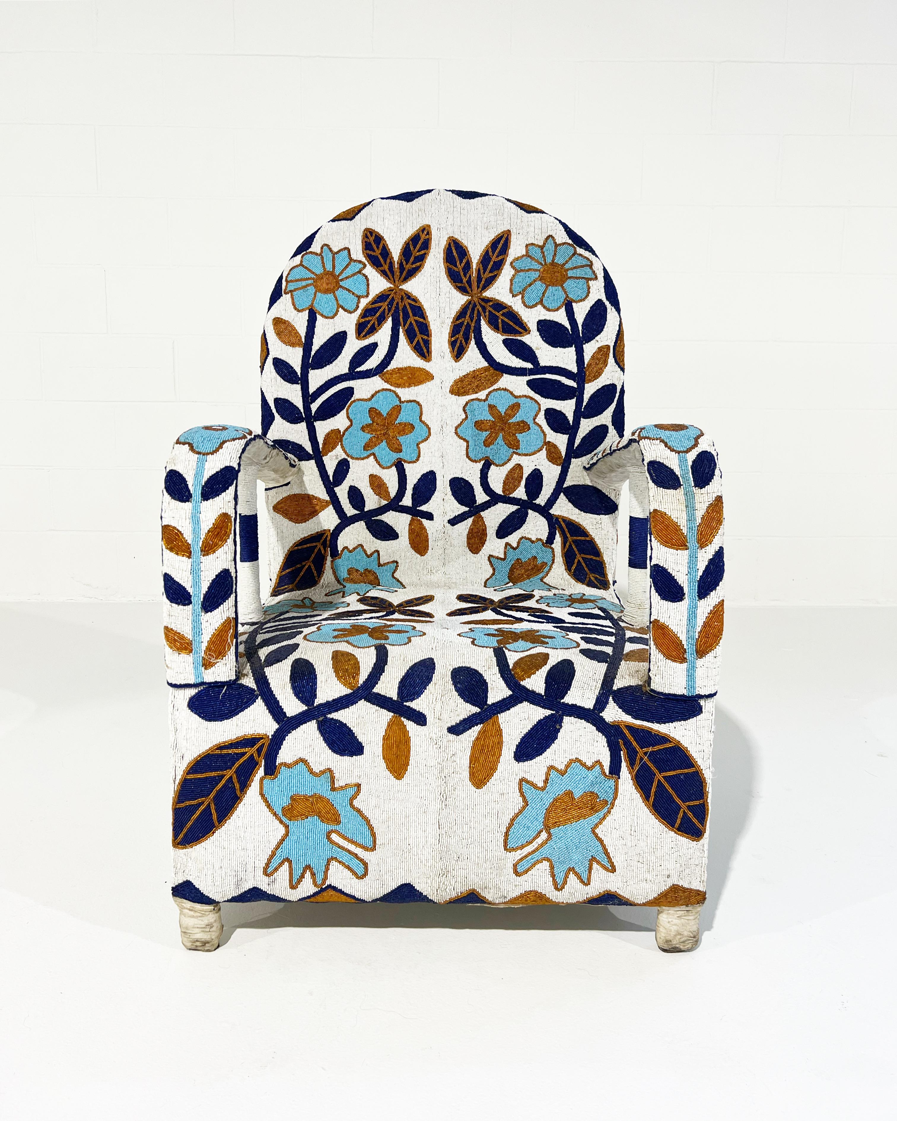 Description
Originally handcrafted for the Nigerian Yoruba Tribe kings and queens, each chair takes approximately 3 months to make. Thousands of tiny glass beads are intricately applied to canvas fabric in beautiful shapes and designs. The fabric is