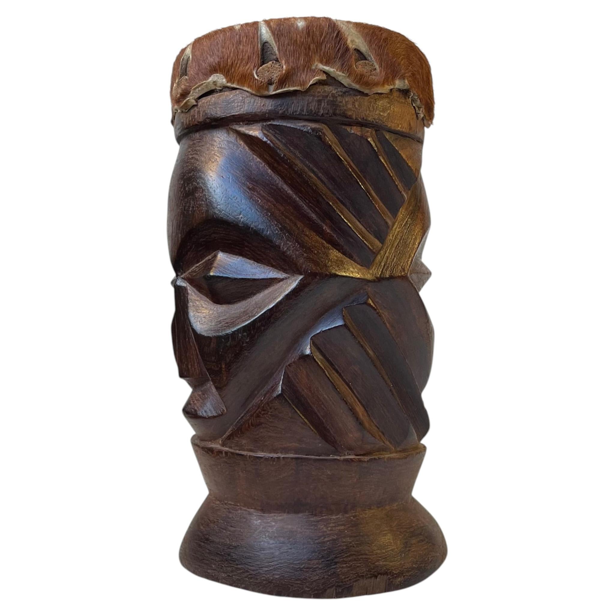 What does the African drum symbolize?